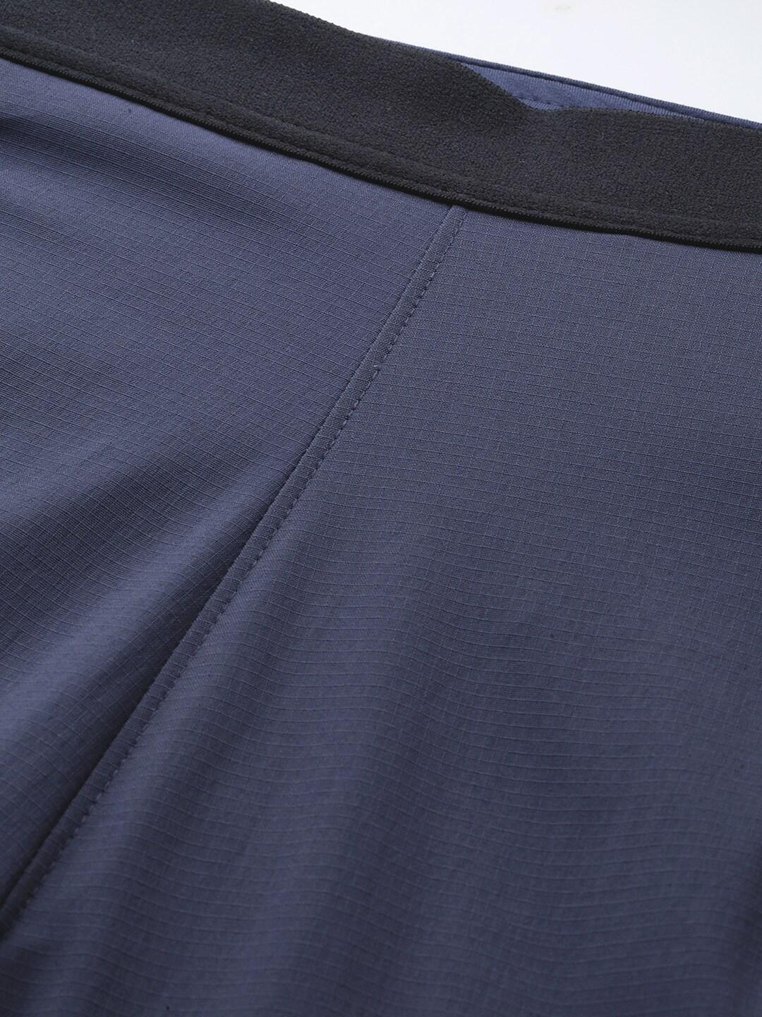 A Women Wearing Columbia Women Navy Blue On The Go Hybrid Pant (Sun Protection)