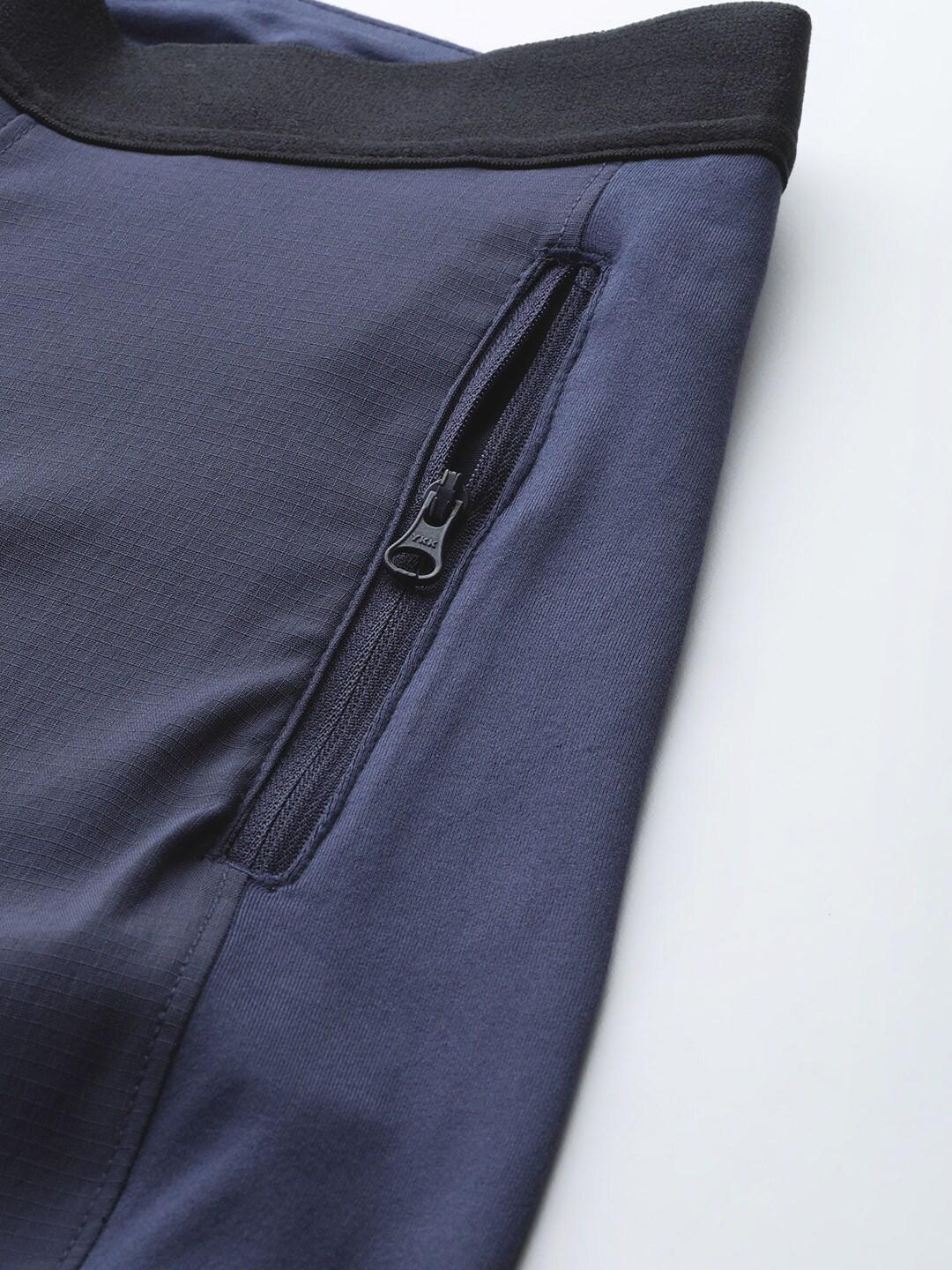 A Women Wearing Columbia Women Navy Blue On The Go Hybrid Pant (Sun Protection)