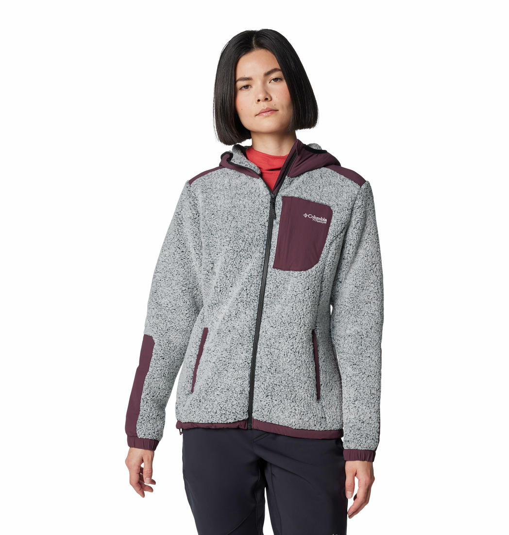 A Women Wearing Columbia Women Red Arctic Crest Sherpa Full Zip
