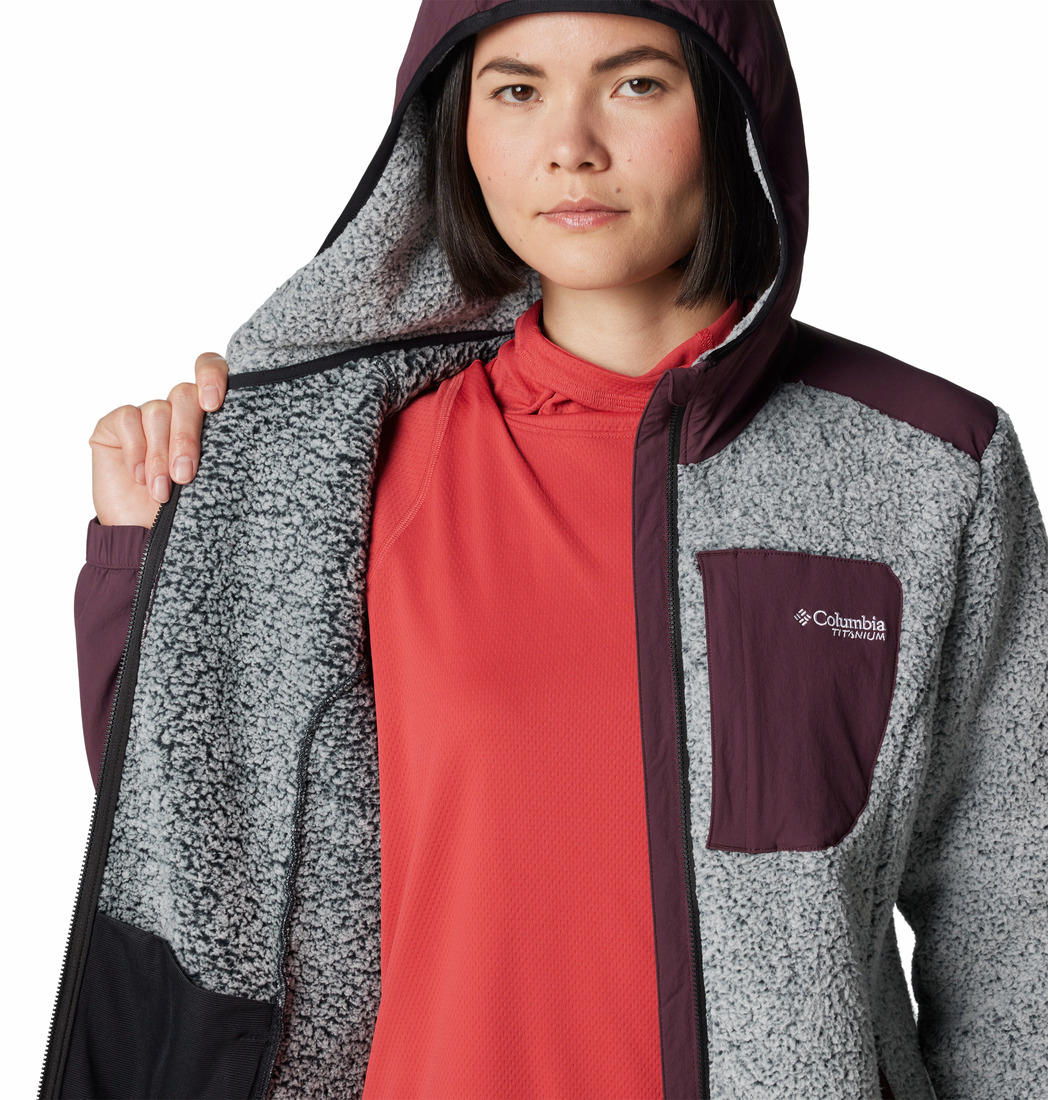 A Women Wearing Columbia Women Red Arctic Crest Sherpa Full Zip