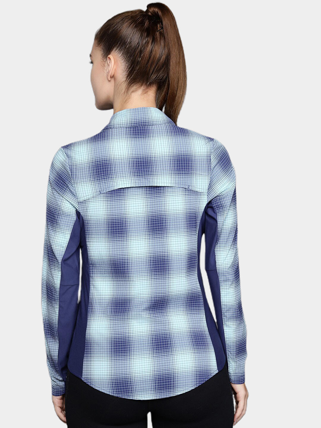 A Women Wearing Columbia Women Blue Claudia Ridge LS Shirt