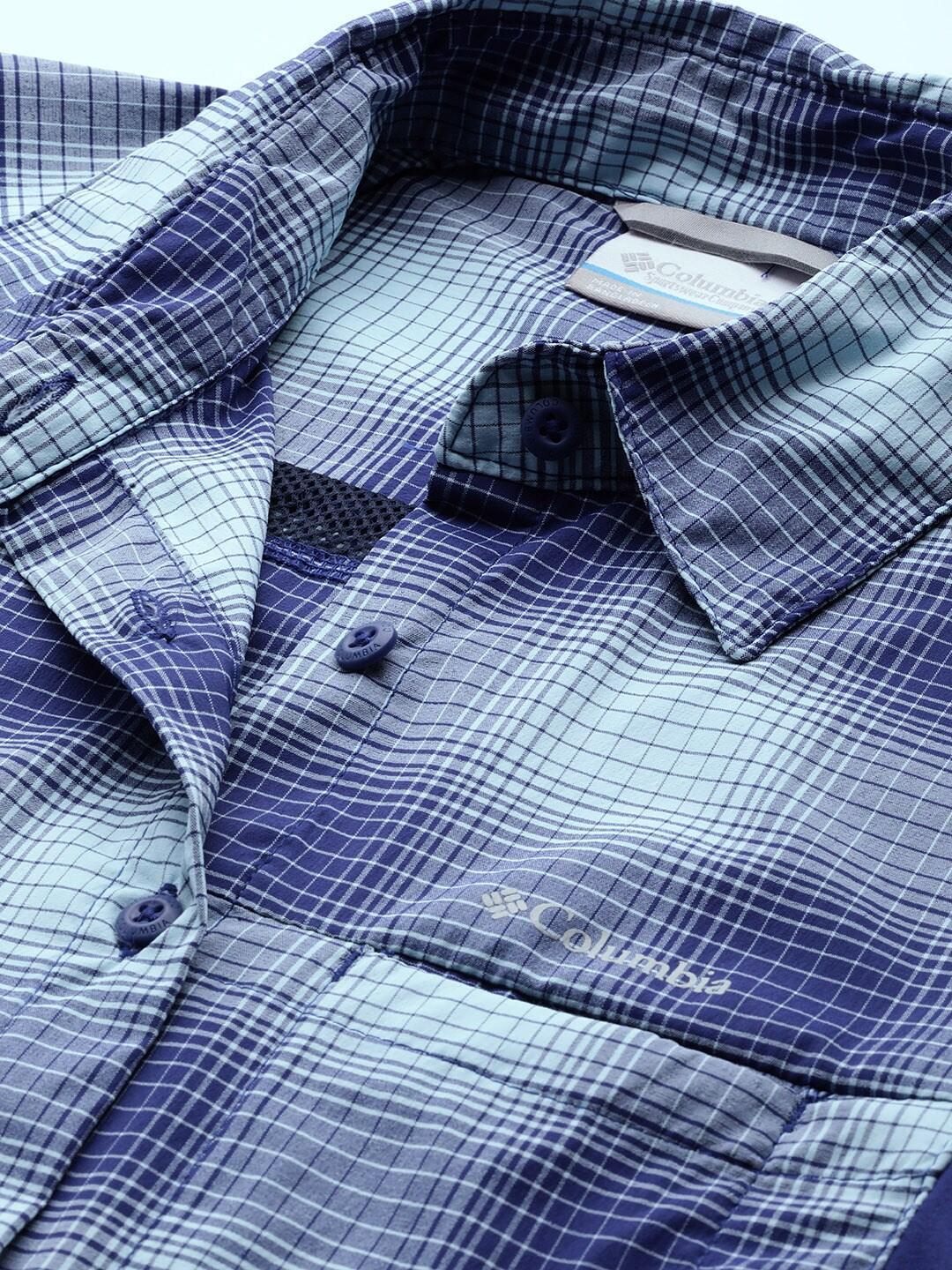 A Women Wearing Columbia Women Blue Claudia Ridge LS Shirt