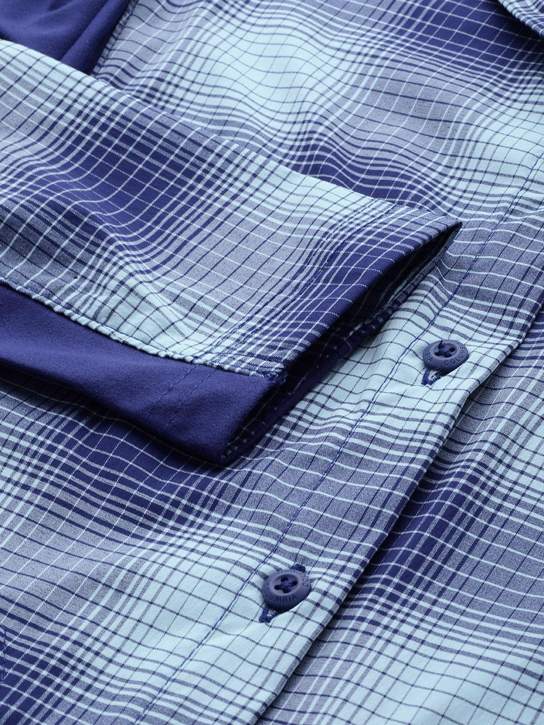 A Women Wearing Columbia Women Blue Claudia Ridge LS Shirt