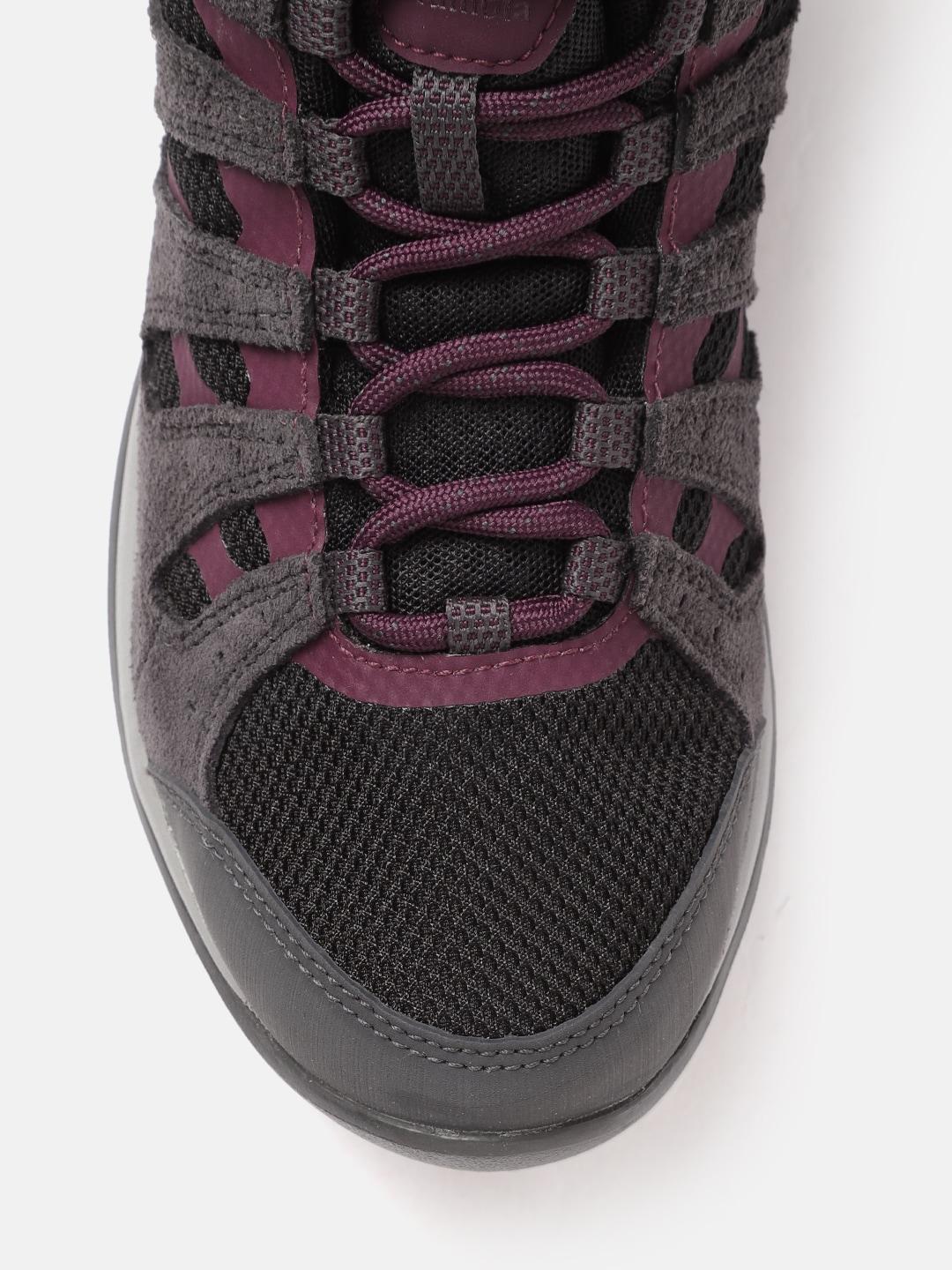 A Women Wearing Columbia Women Black REDMOND V2 MID WP