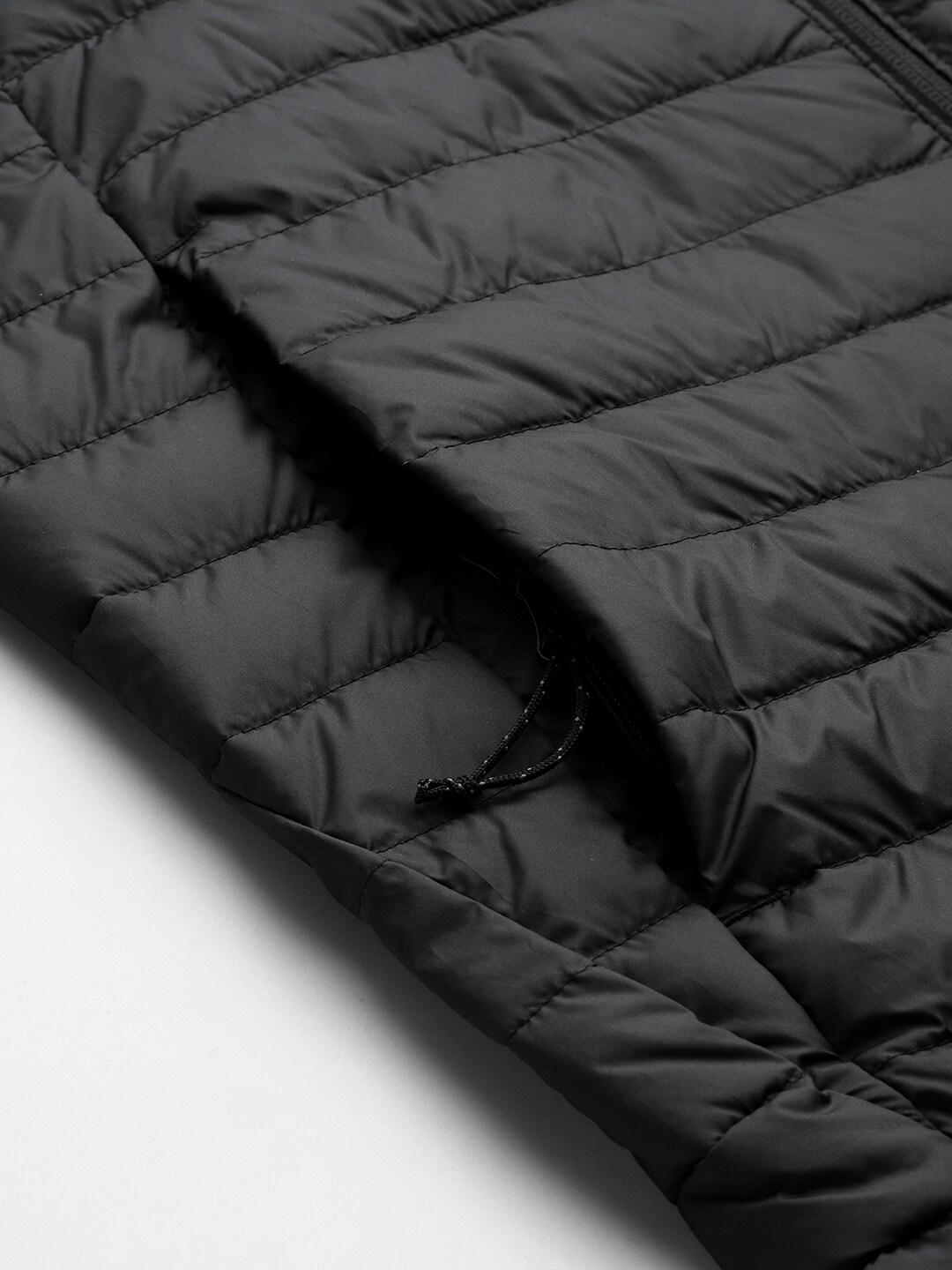 A Men Wearing Columbia Men Black Silver Falls Vest