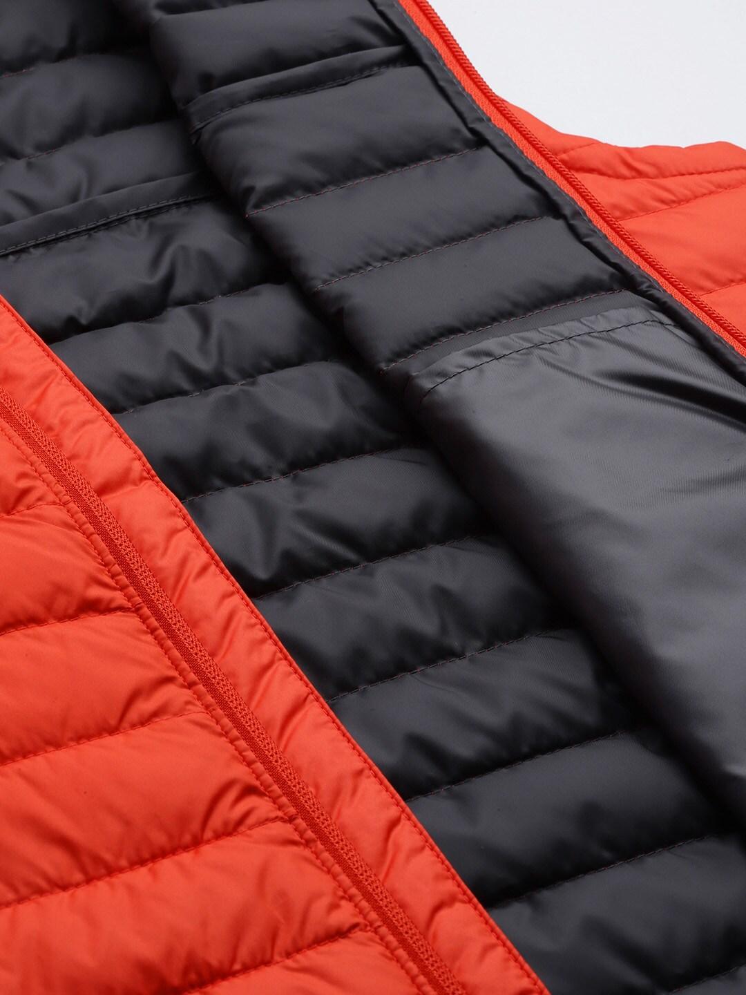 A Men Wearing Columbia Men Orange Silver Falls Vest