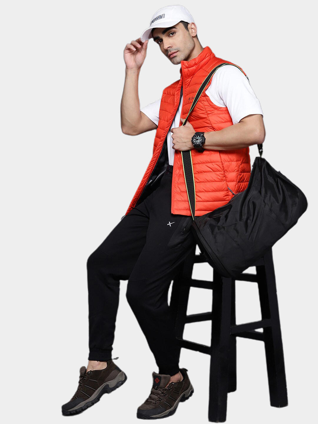A Men Wearing Columbia Men Orange Silver Falls Vest