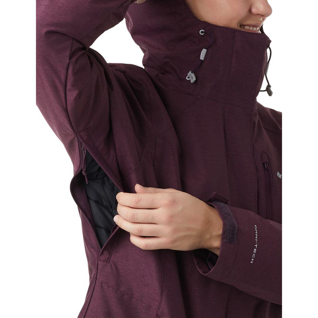 A Women Wearing Columbia Women Maroon Whirlibird IV Interchange Jacket