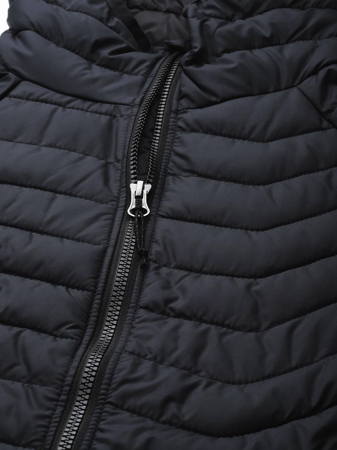 A Women Wearing Columbia Women Black Powder Lite Hooded Jacket