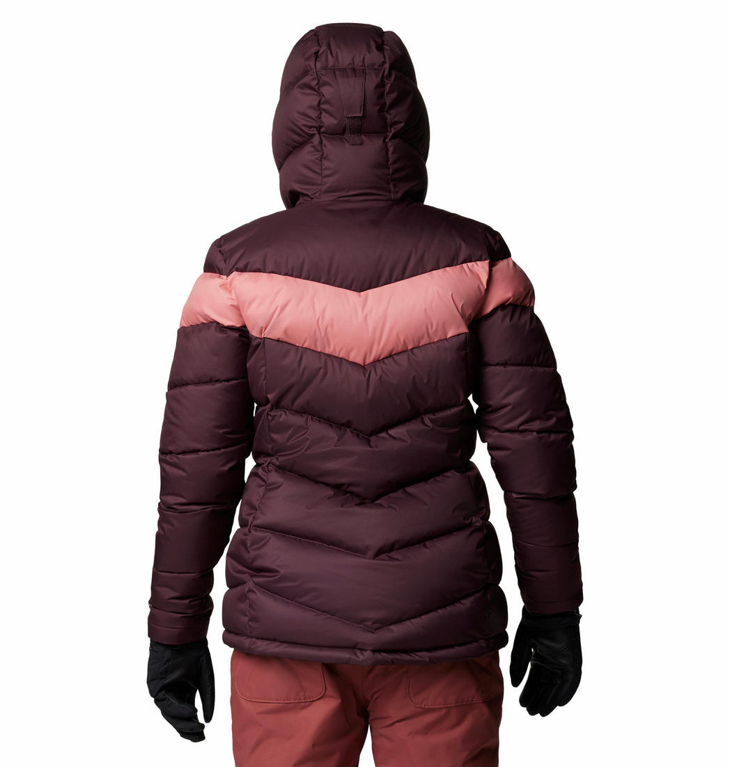 A Women Wearing Columbia Women Red Abbott Peak II Insulated Jacket