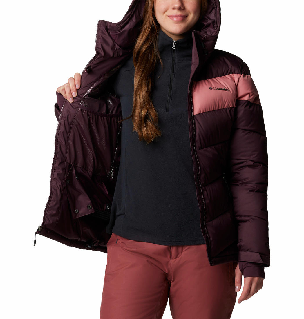 A Women Wearing Columbia Women Red Abbott Peak II Insulated Jacket