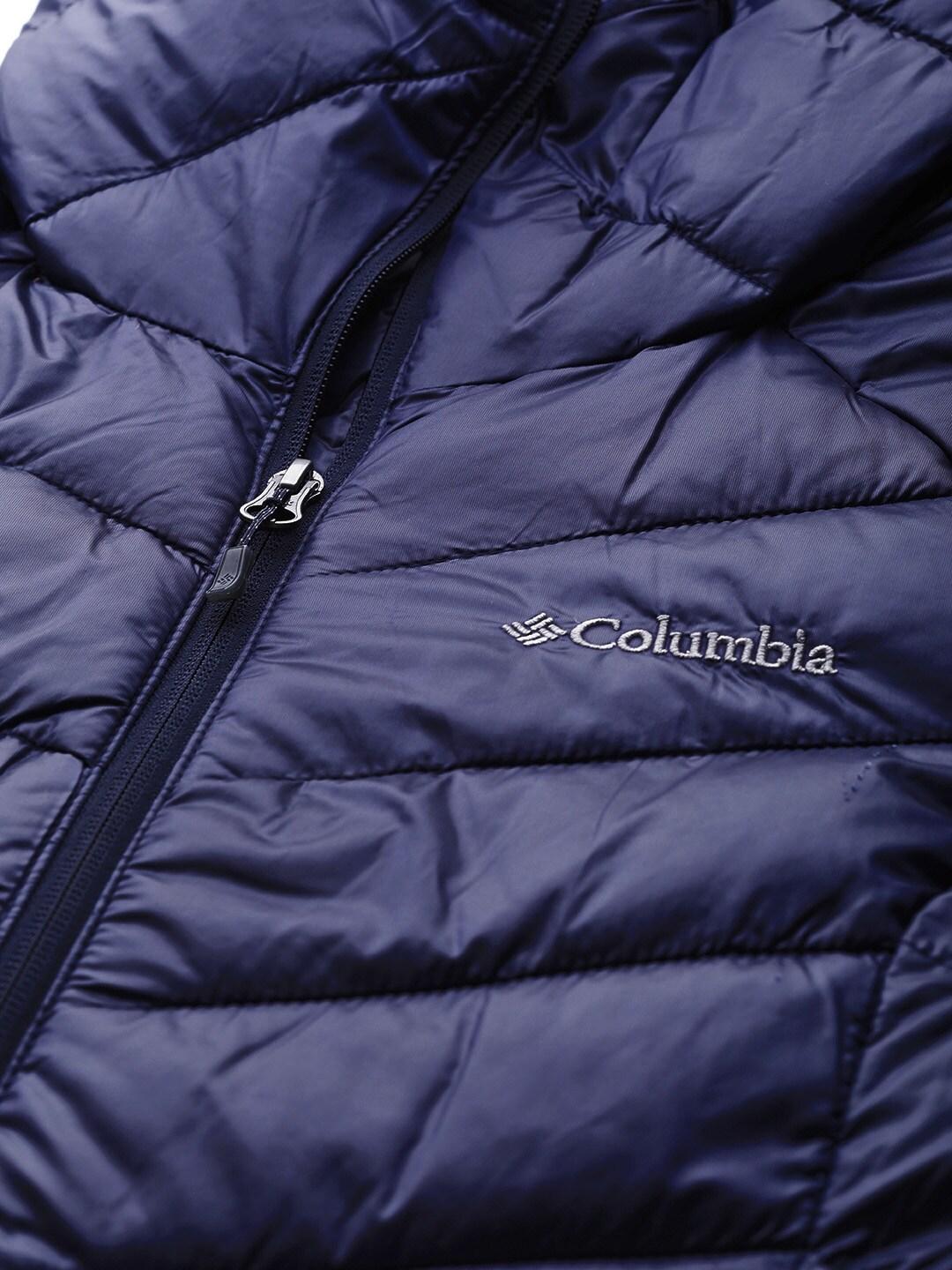 A Women Wearing Columbia Women Navy Blue Joy Peak Mid Jacket
