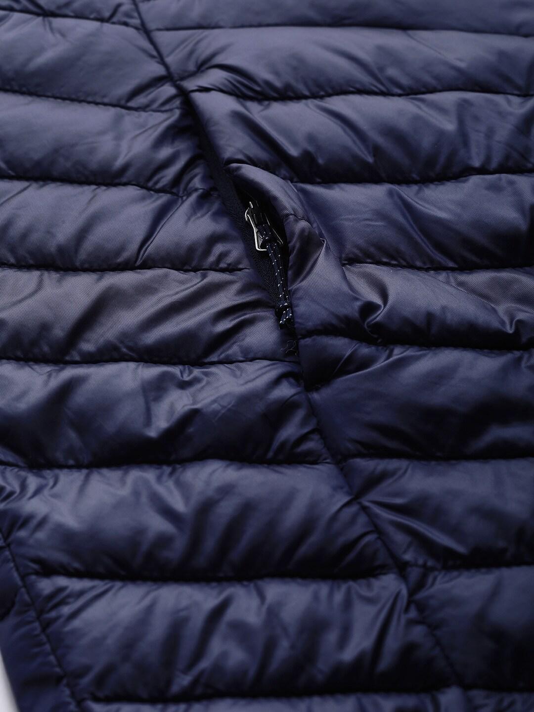 A Women Wearing Columbia Women Navy Blue Joy Peak Mid Jacket