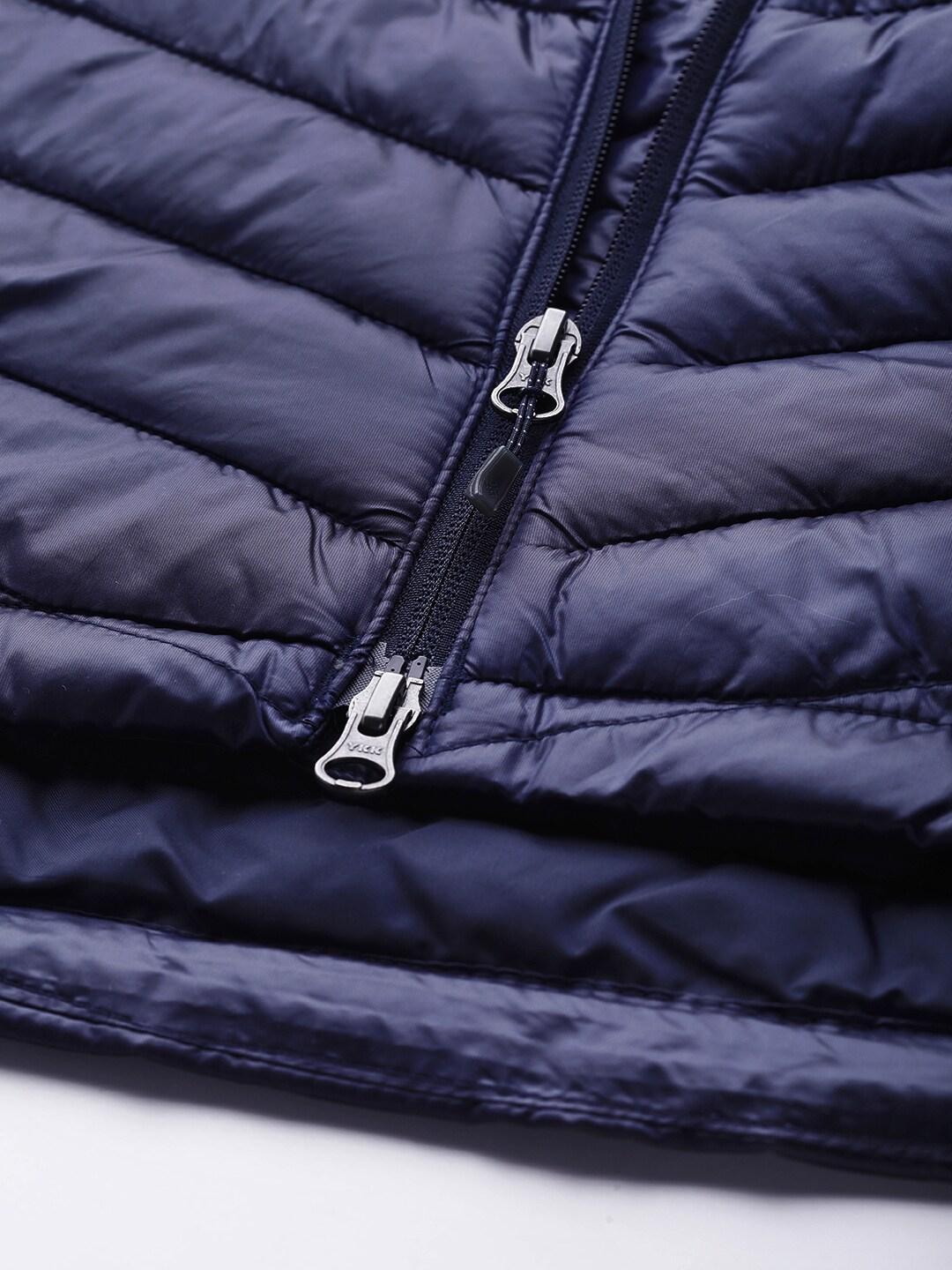 A Women Wearing Columbia Women Navy Blue Joy Peak Mid Jacket