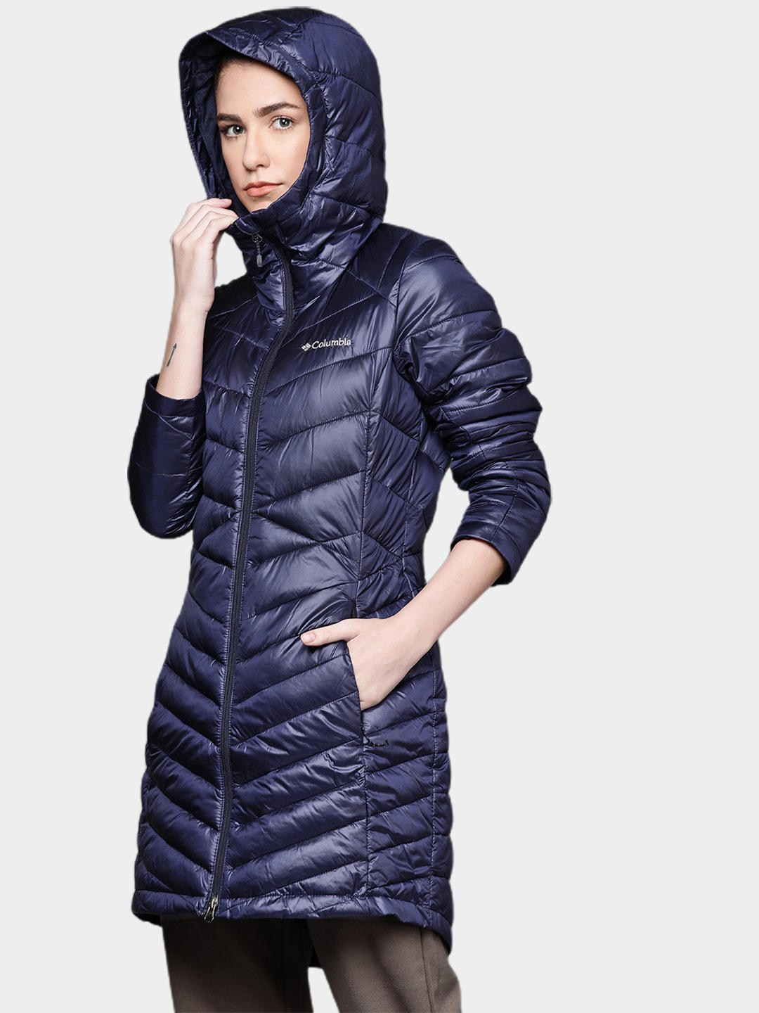 A Women Wearing Columbia Women Navy Blue Joy Peak Mid Jacket