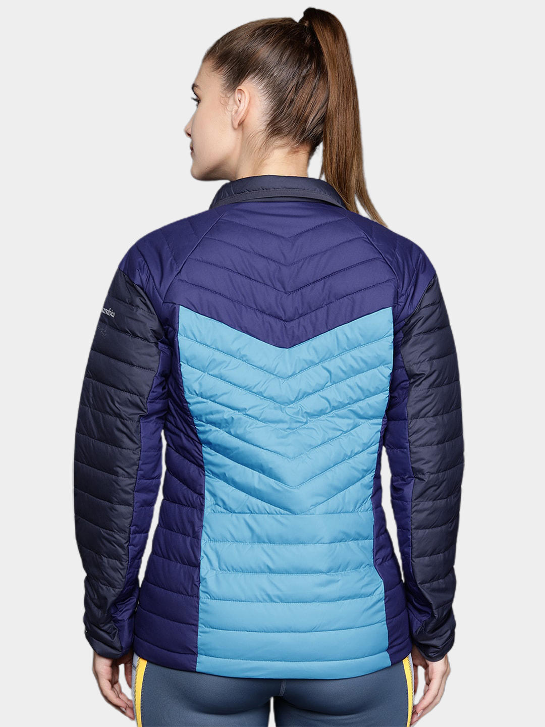 A Women Wearing Columbia Women Blue Powder Lite II Full Zip Jacket