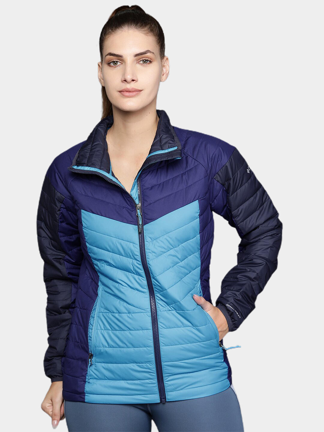 A Women Wearing Columbia Women Blue Powder Lite II Full Zip Jacket