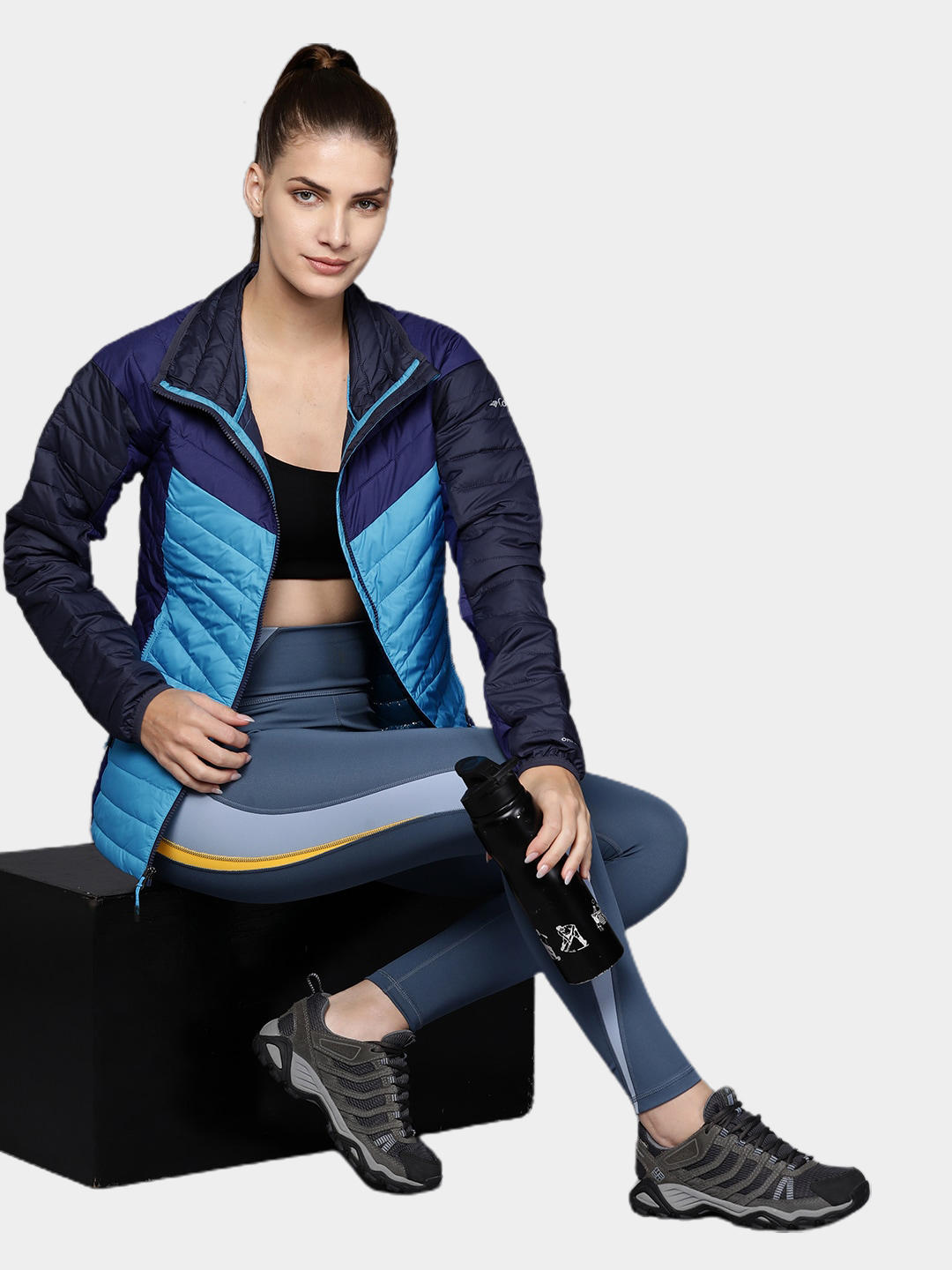 A Women Wearing Columbia Women Blue Powder Lite II Full Zip Jacket