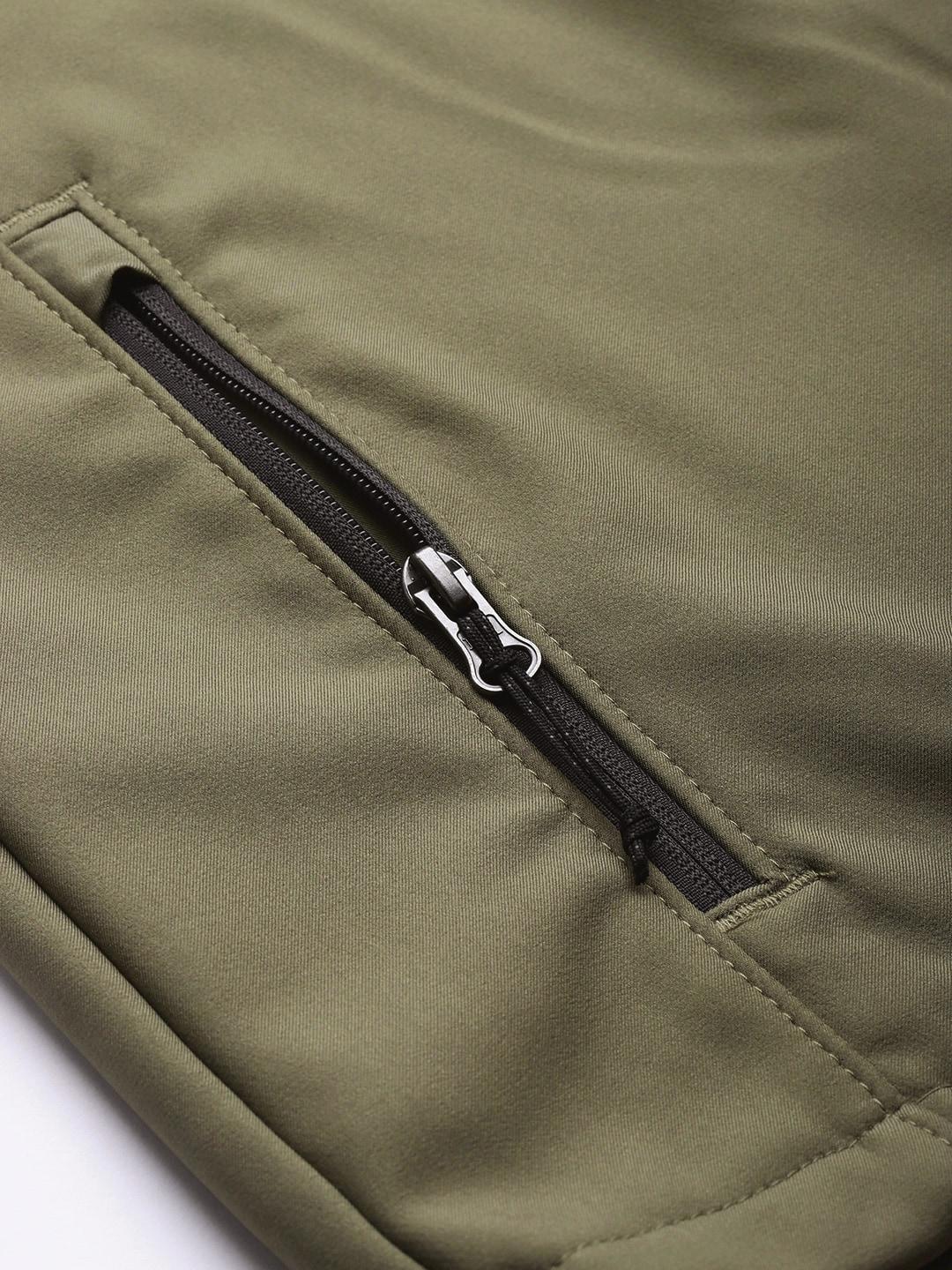 A Men Wearing Columbia Men Green Ascender Softshell Jacket