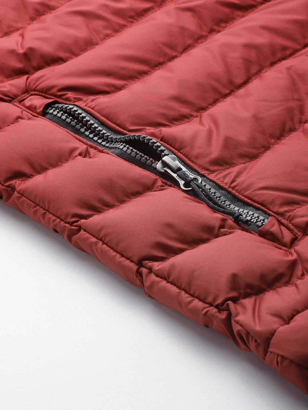 A Men Wearing Columbia Men Red Powder Lite Vest