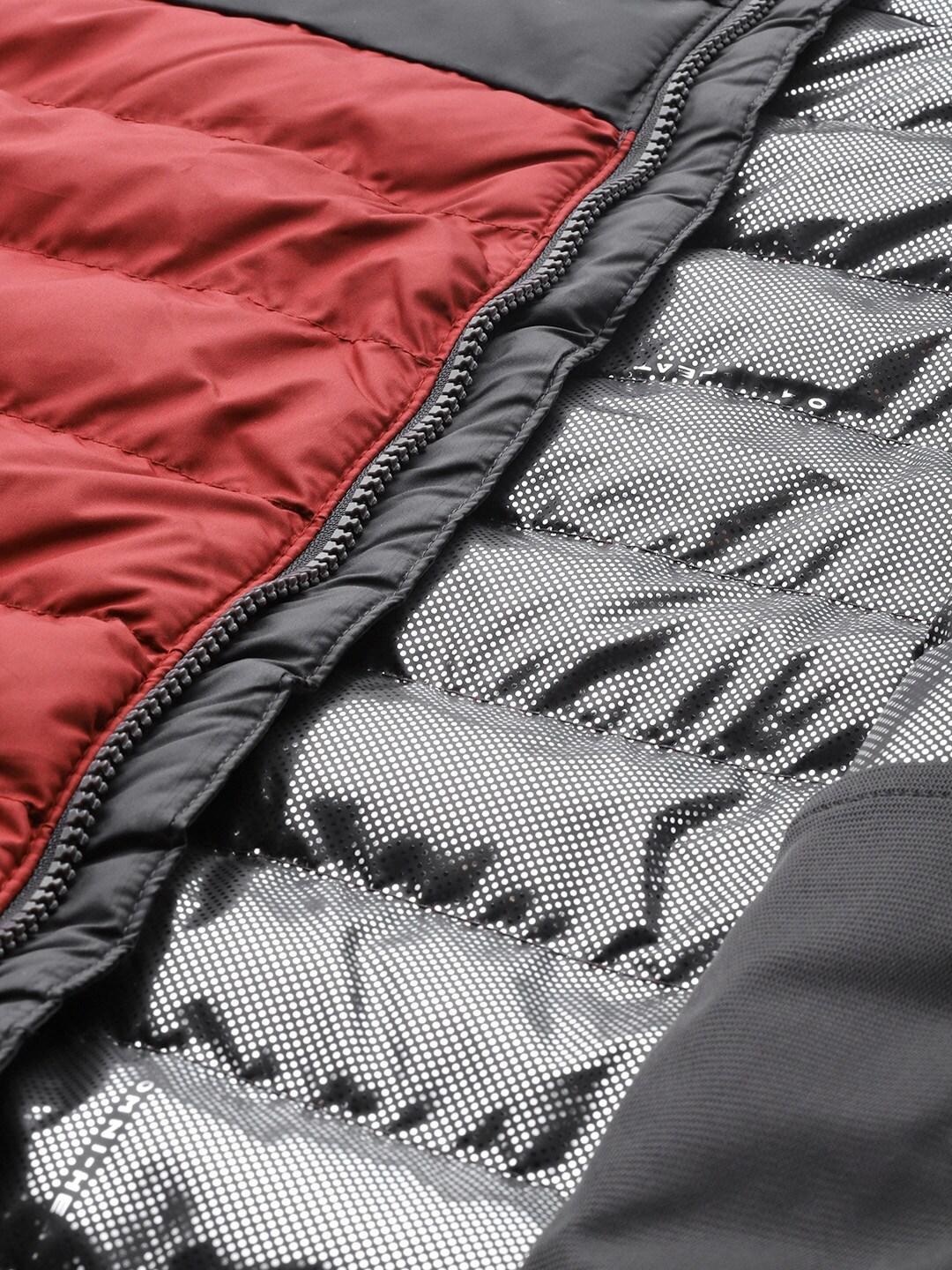 A Men Wearing Columbia Men Red Powder Lite Vest