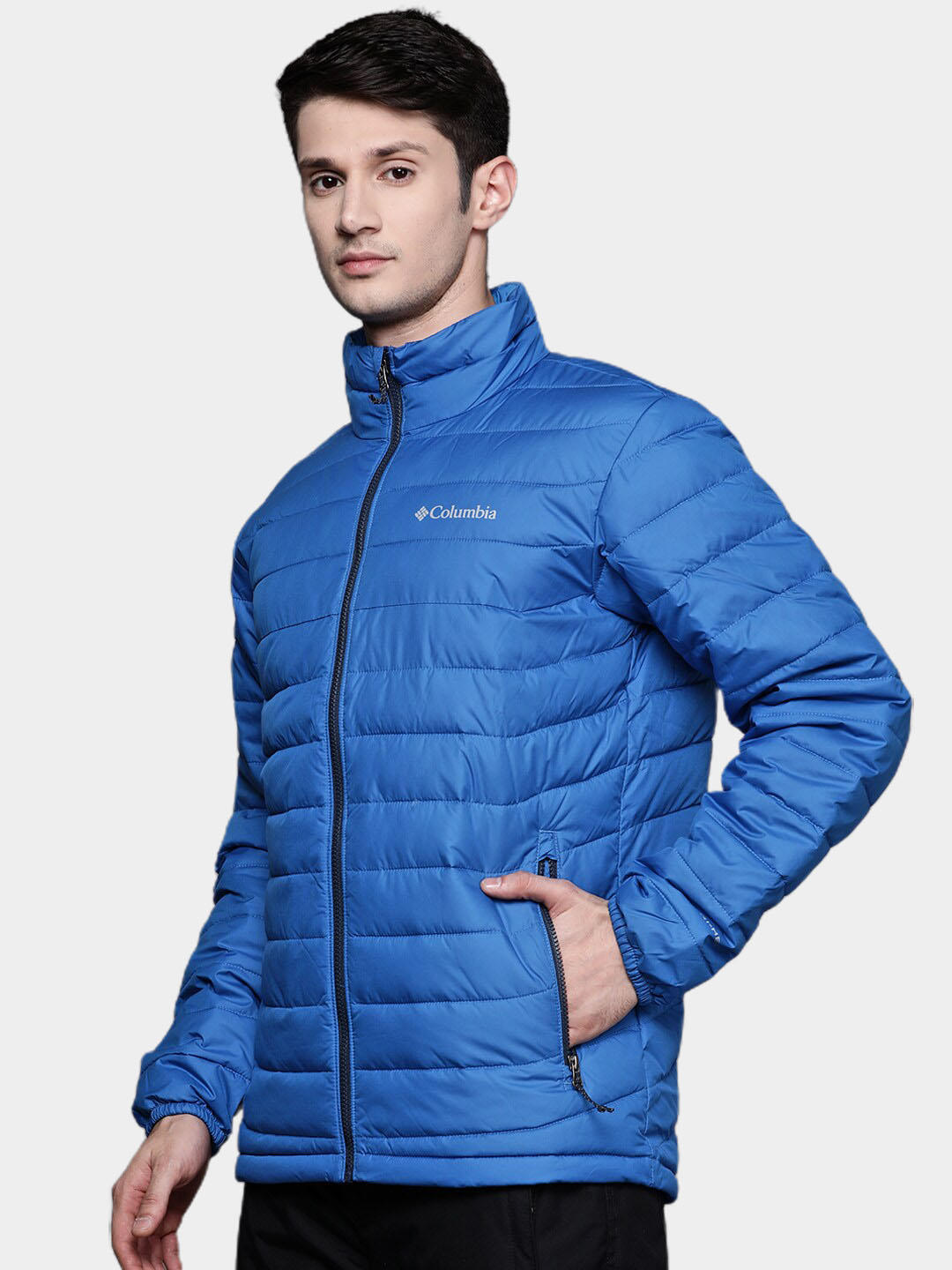 A Men Wearing Columbia Men Blue Powder Lite Jacket
