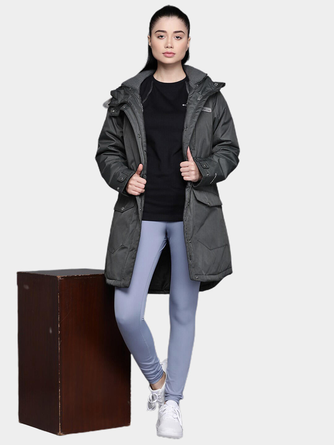 A Women Wearing Columbia Women Black Suttle Mountain Long Insulated Jacket