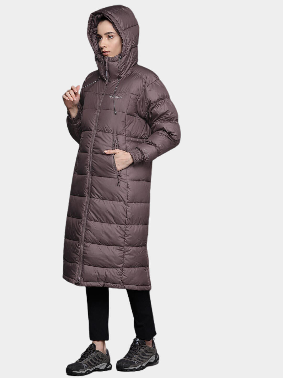 A Women Wearing Columbia Women Brown Pike Lake II Long Jacket