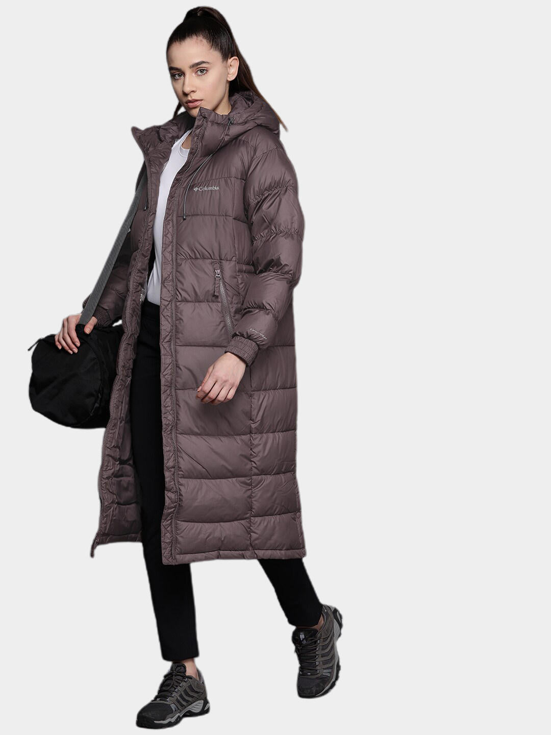 A Women Wearing Columbia Women Brown Pike Lake II Long Jacket