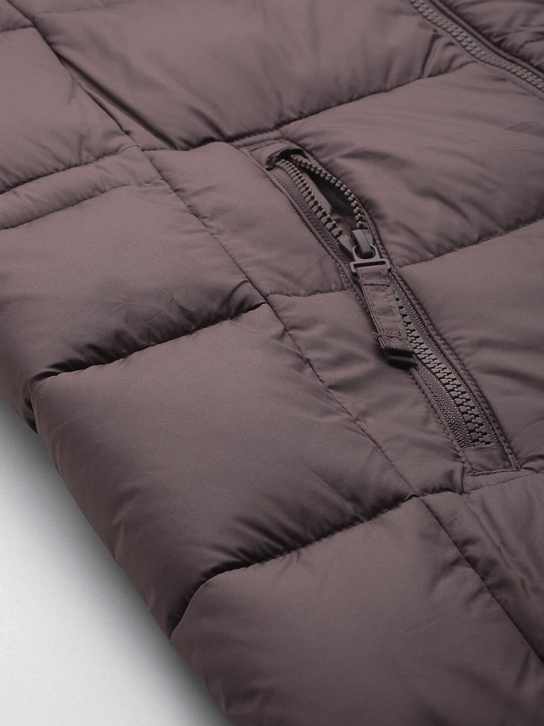 A Women Wearing Columbia Women Brown Pike Lake II Long Jacket