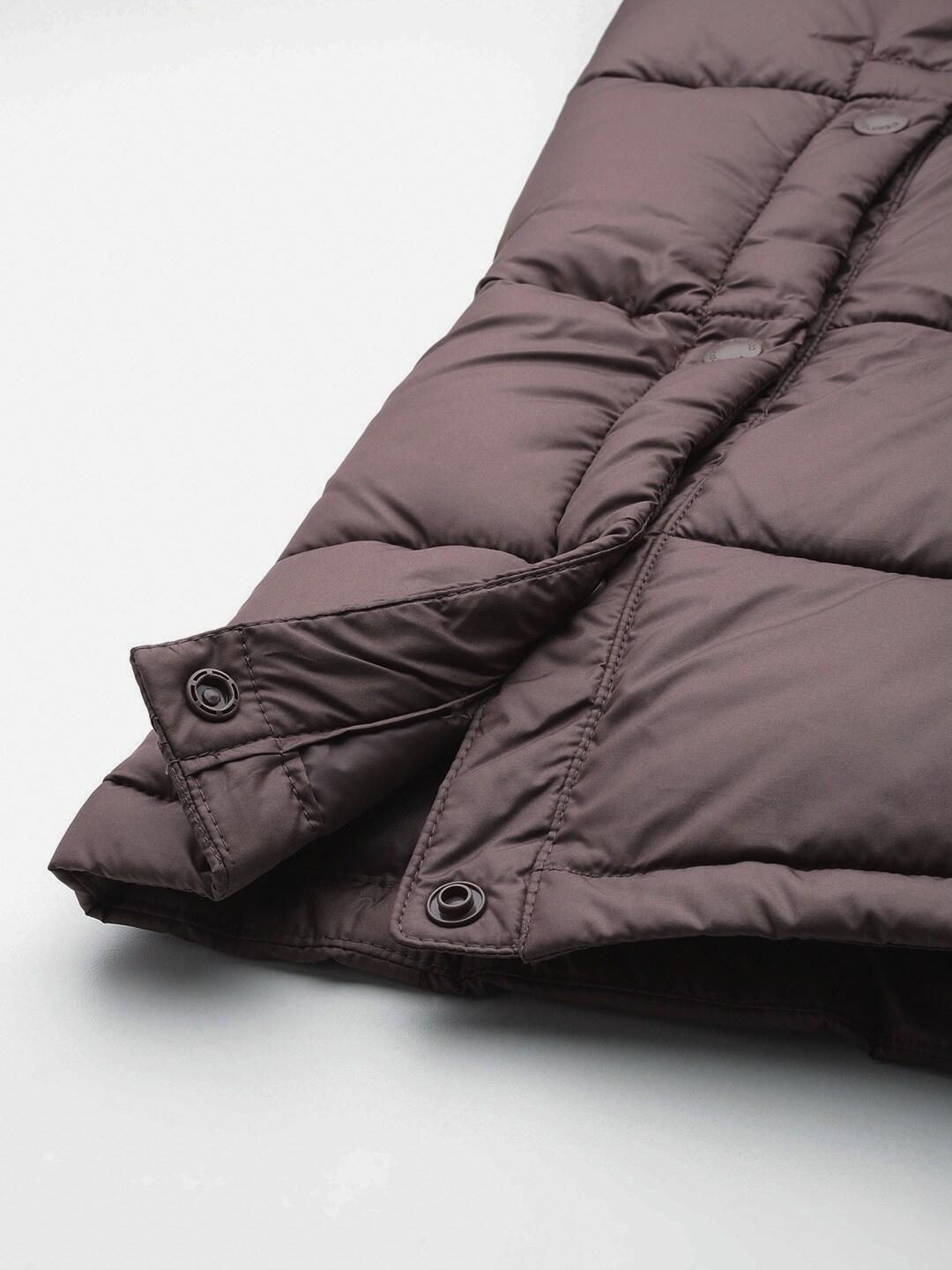 A Women Wearing Columbia Women Brown Pike Lake II Long Jacket