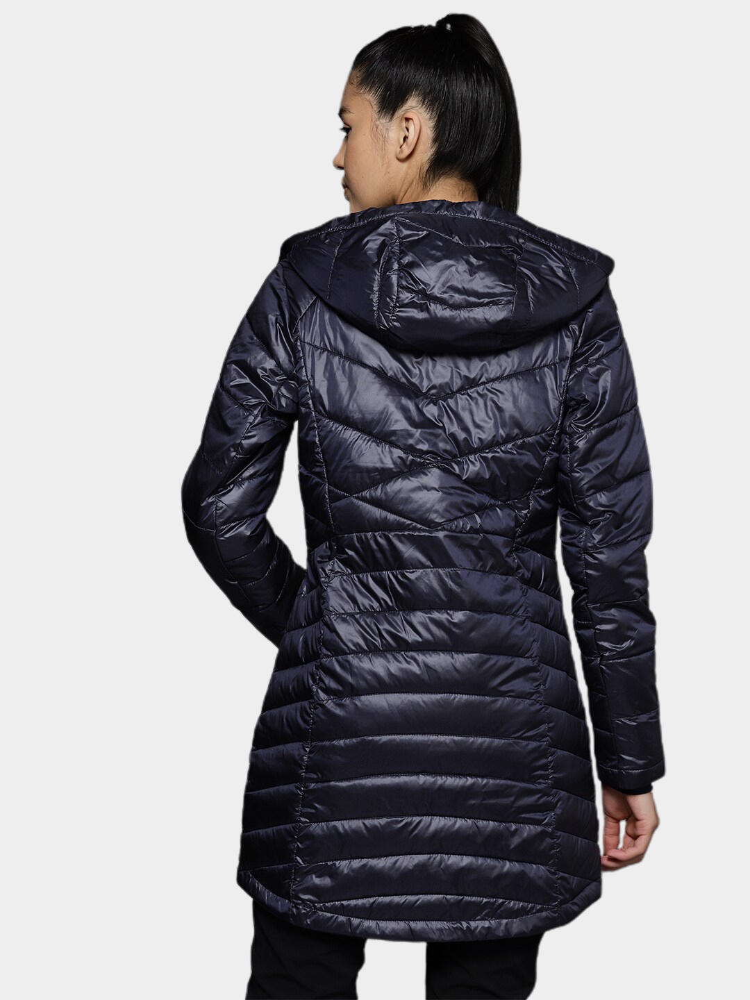 A Women Wearing Columbia Women Navy Blue Joy Peak Mid Jacket