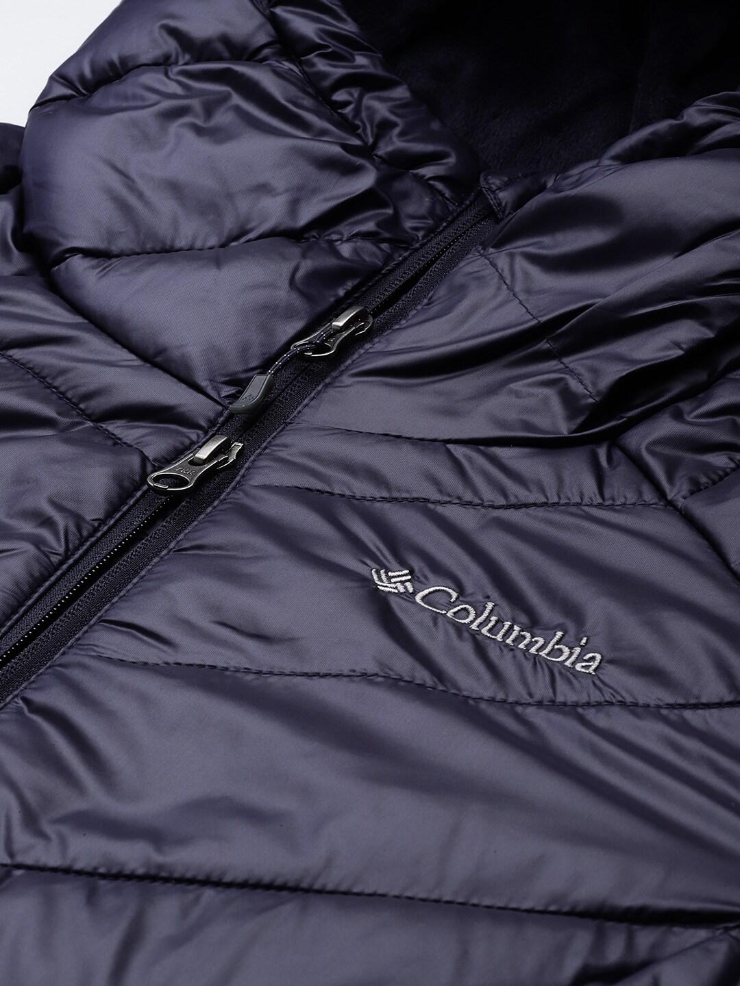 A Women Wearing Columbia Women Navy Blue Joy Peak Mid Jacket