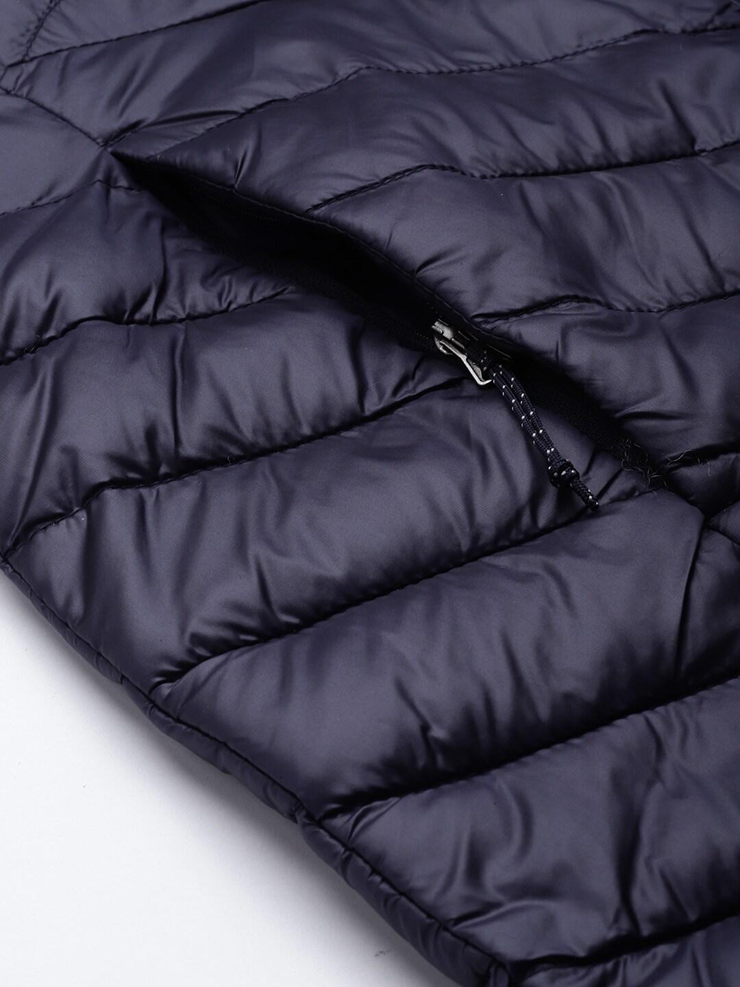 A Women Wearing Columbia Women Navy Blue Joy Peak Mid Jacket