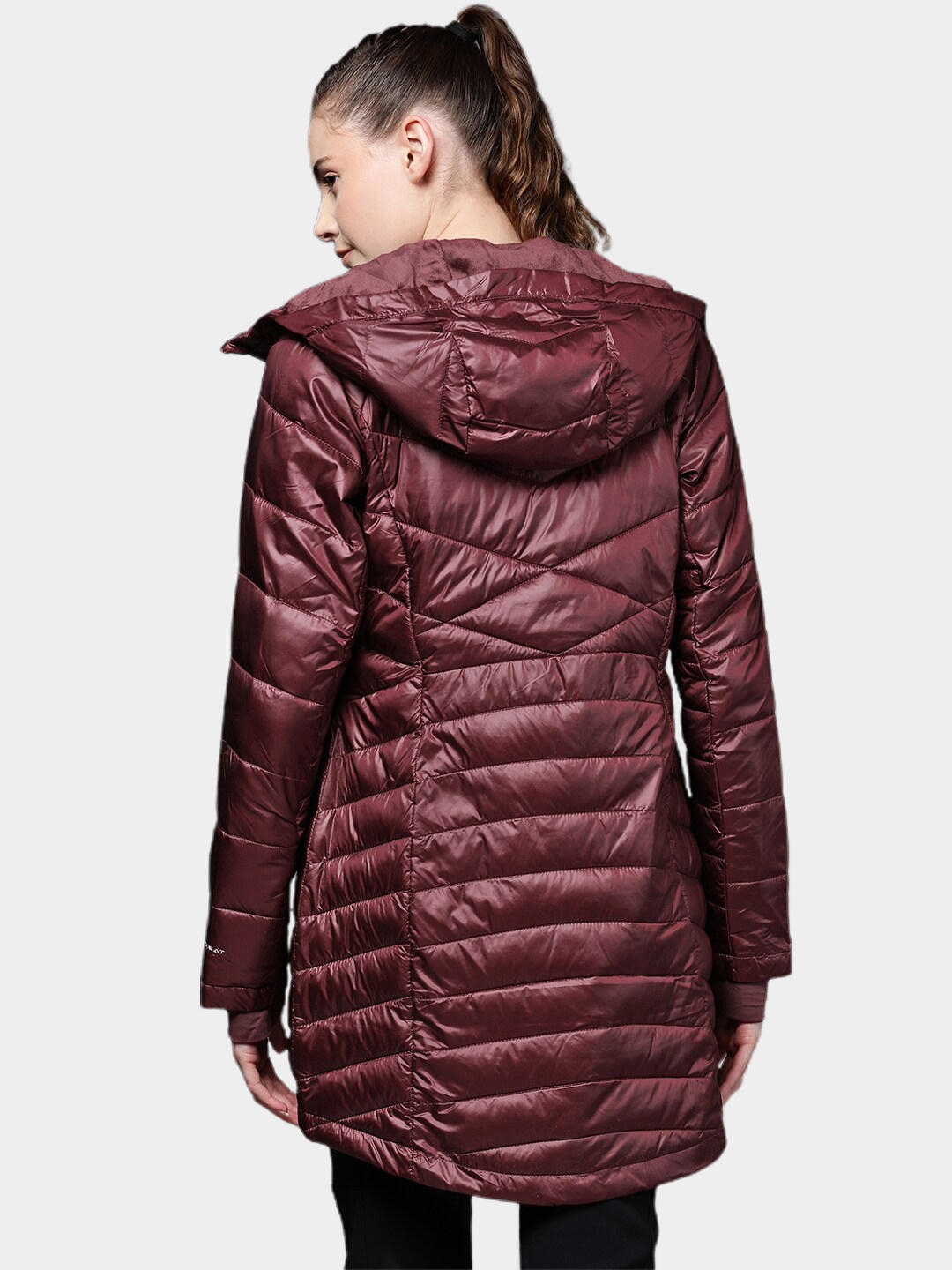A Women Wearing Columbia Women Maroon Joy Peak Mid Jacket
