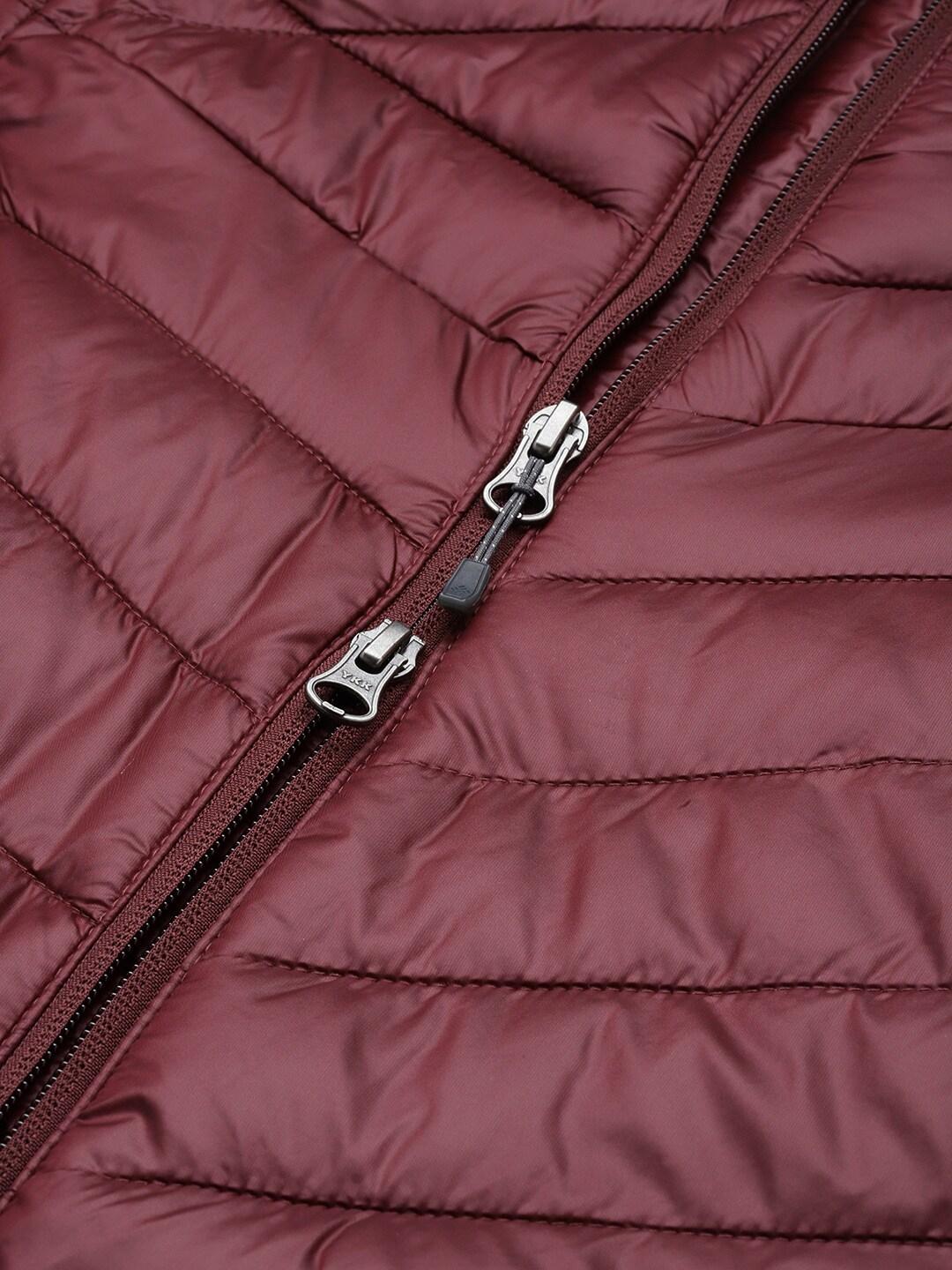 A Women Wearing Columbia Women Maroon Joy Peak Mid Jacket