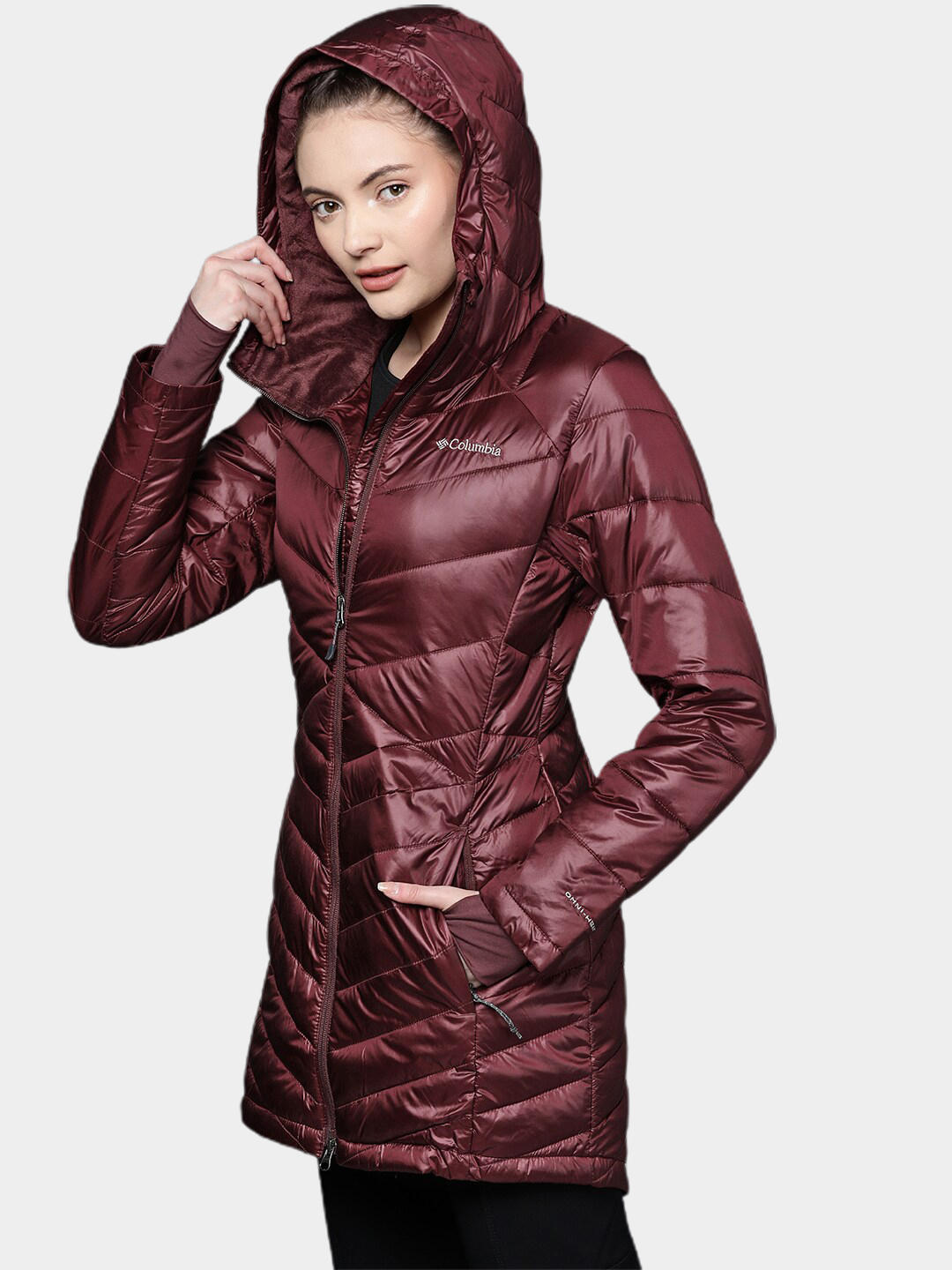 A Women Wearing Columbia Women Maroon Joy Peak Mid Jacket