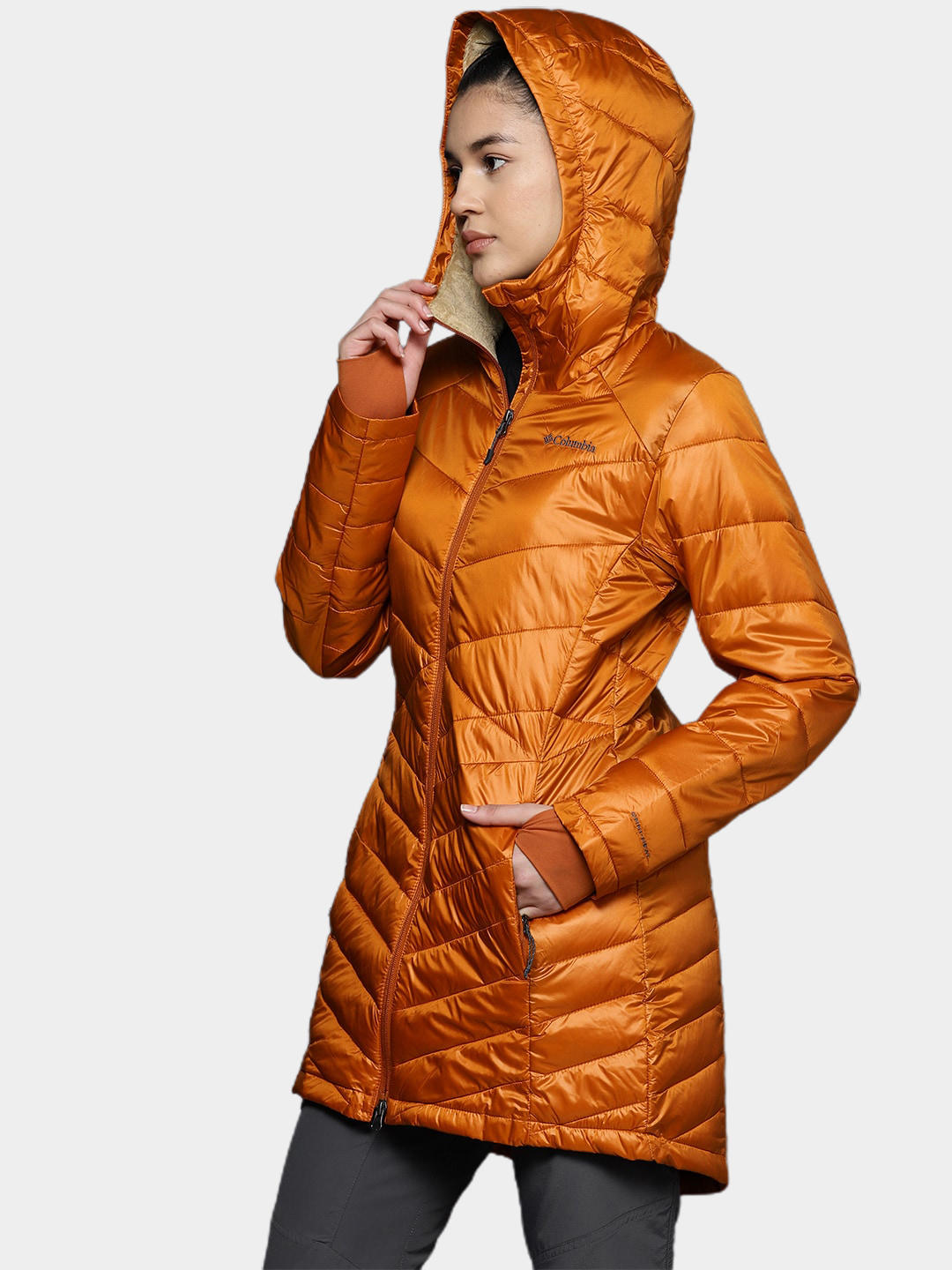A Women Wearing Columbia Women Orange Joy Peak Mid Jacket