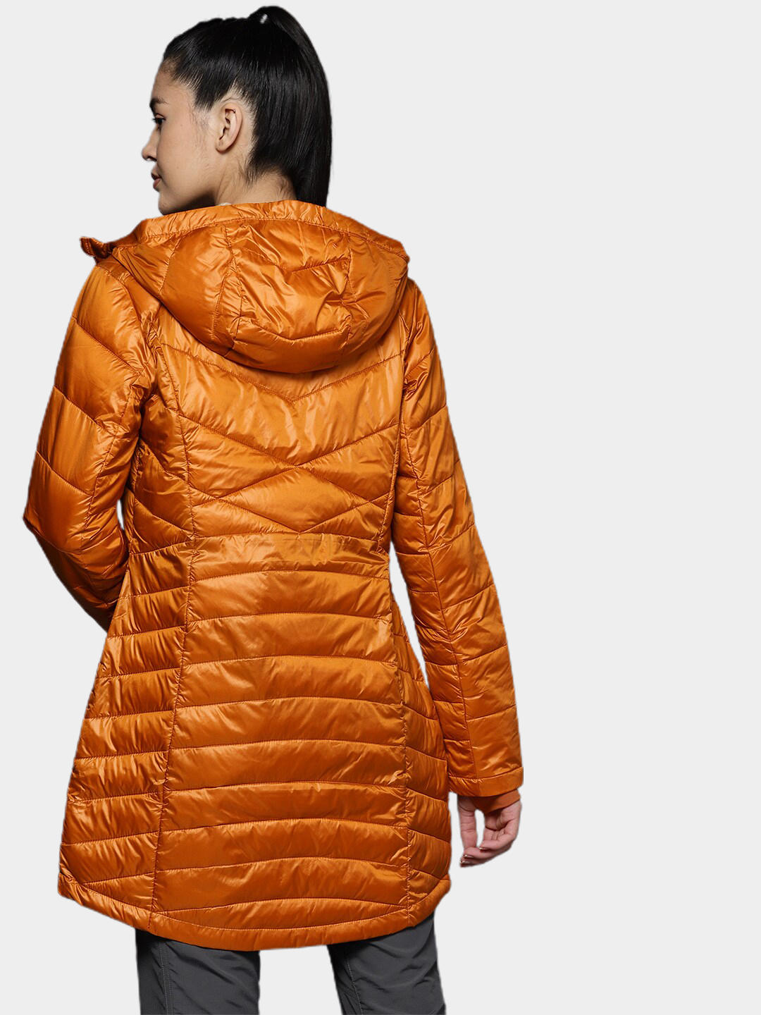 A Women Wearing Columbia Women Orange Joy Peak Mid Jacket