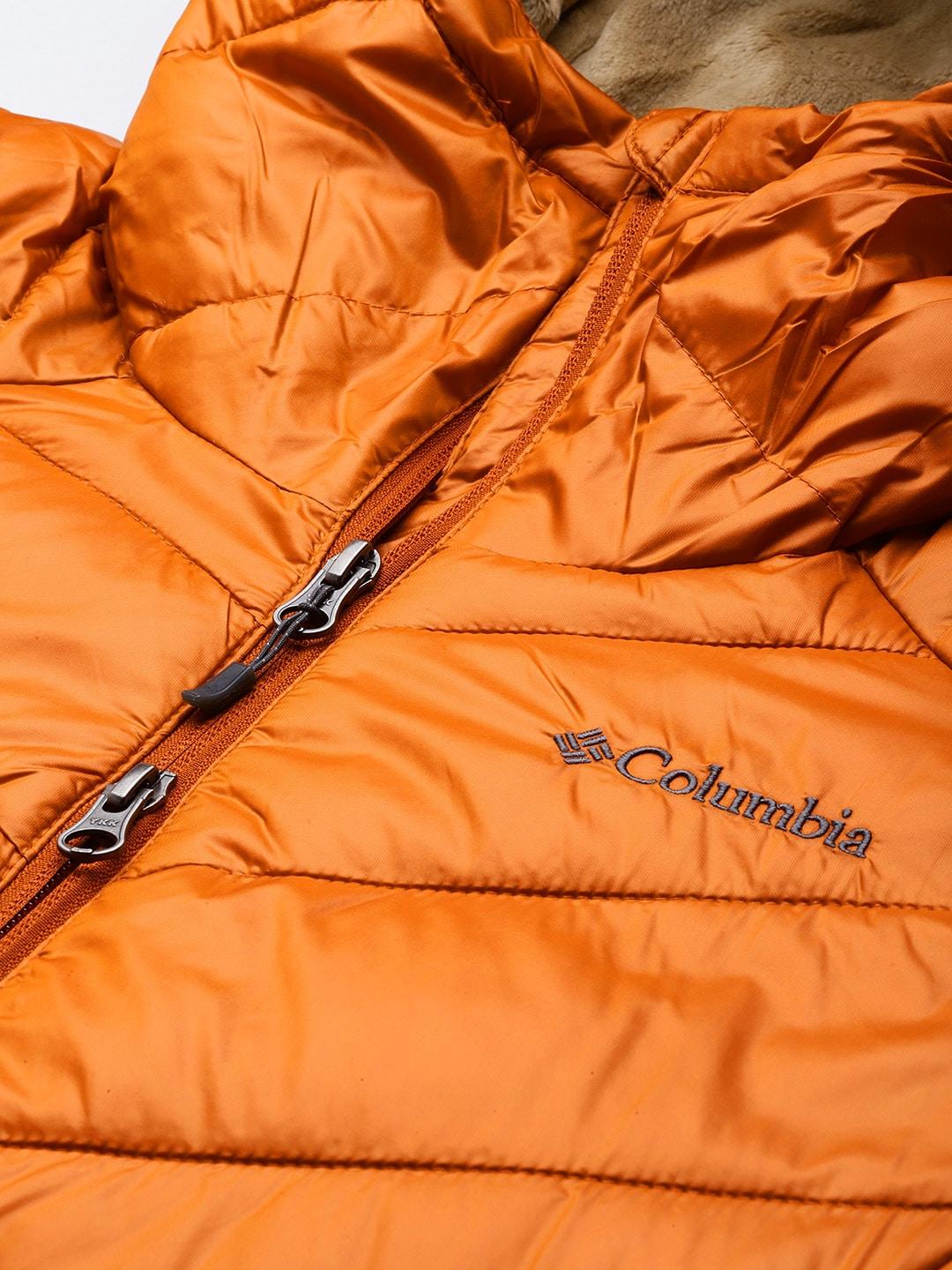 A Women Wearing Columbia Women Orange Joy Peak Mid Jacket