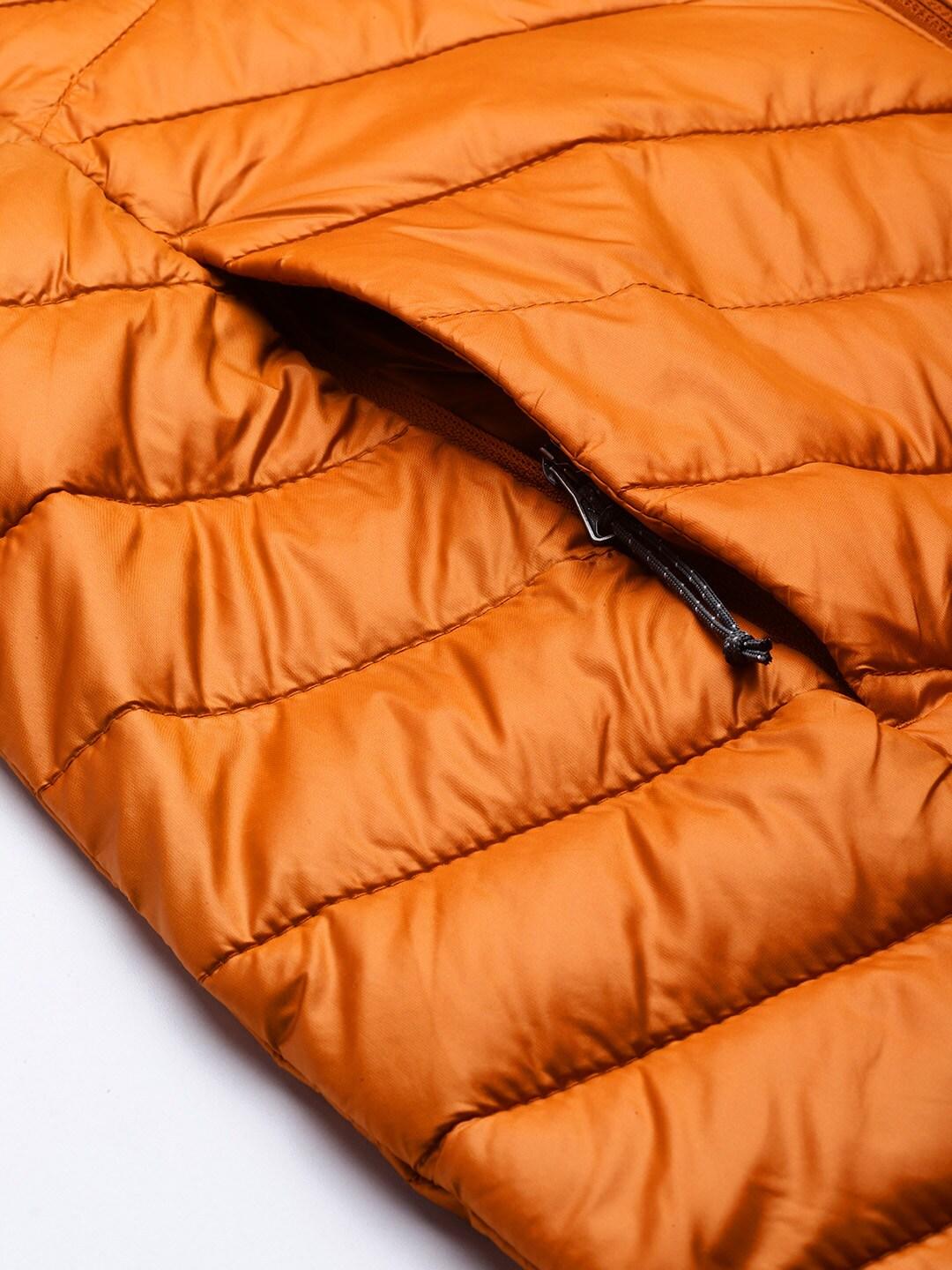 A Women Wearing Columbia Women Orange Joy Peak Mid Jacket