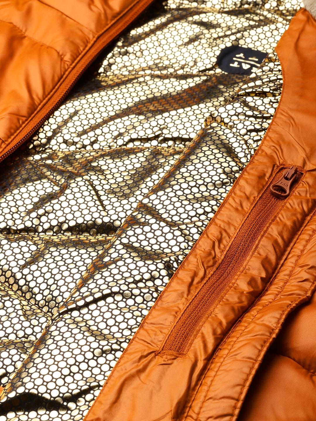 A Women Wearing Columbia Women Orange Joy Peak Mid Jacket