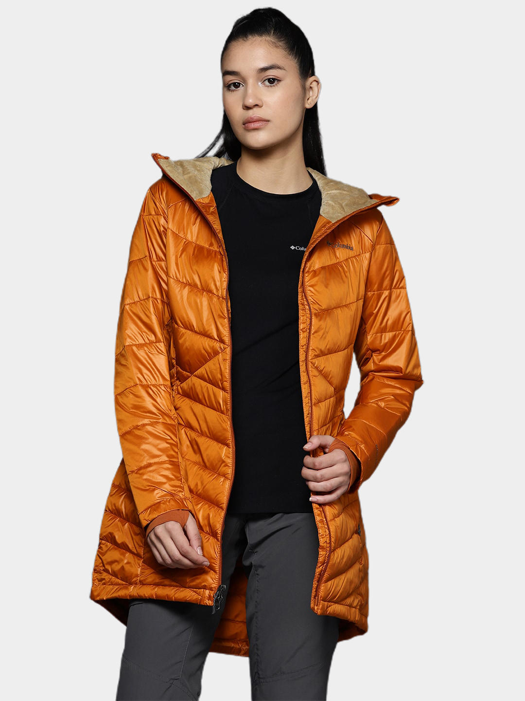 A Women Wearing Columbia Women Orange Joy Peak Mid Jacket