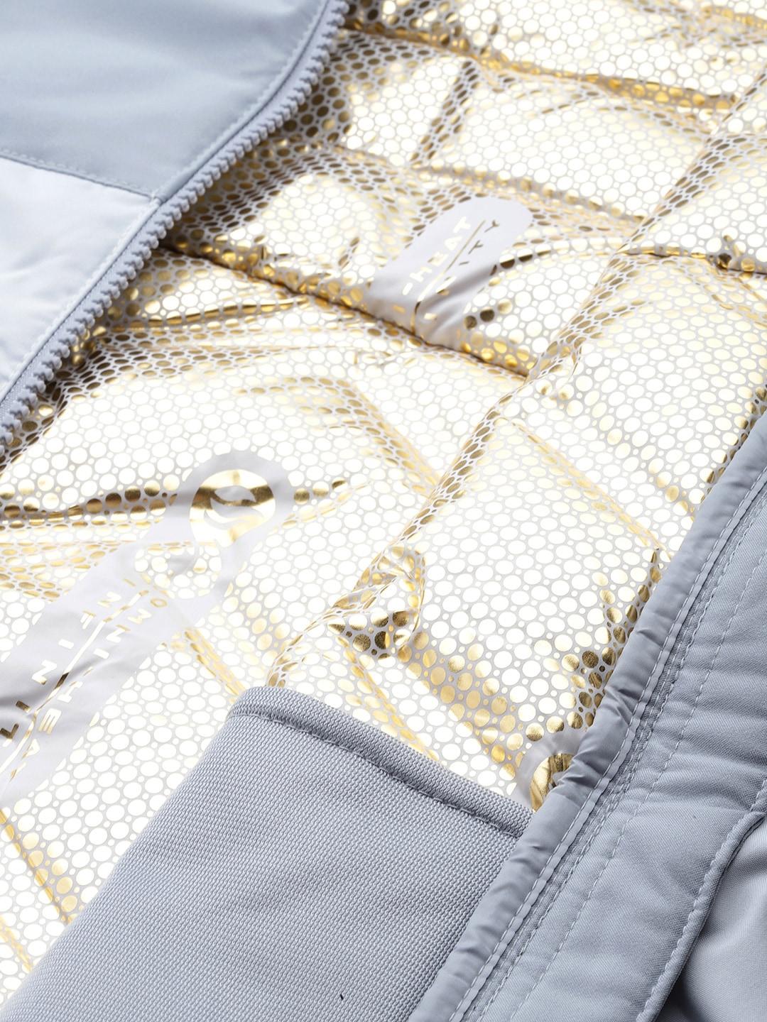 A Women Wearing Columbia Women Grey Grand Trek II Down Jacket