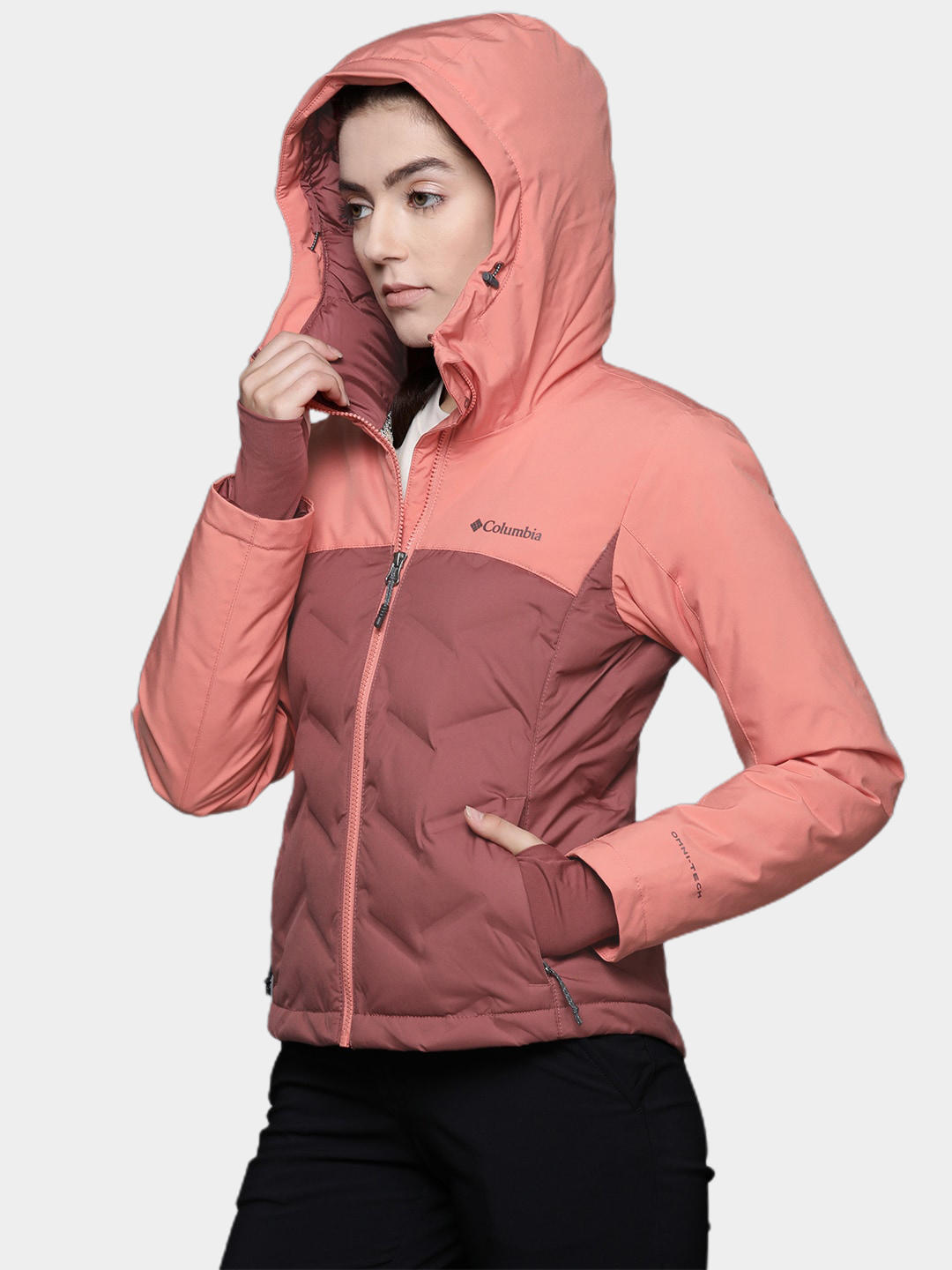 A Women Wearing Columbia Women Pink Grand Trek II Down Jacket