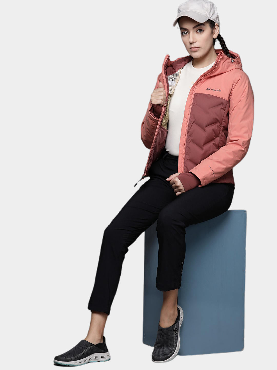 A Women Wearing Columbia Women Pink Grand Trek II Down Jacket