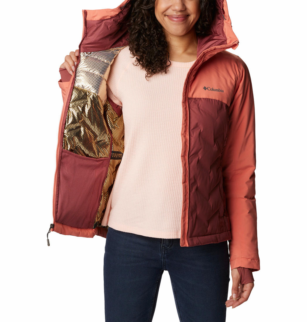 A Women Wearing Columbia Women Pink Grand Trek II Down Jacket