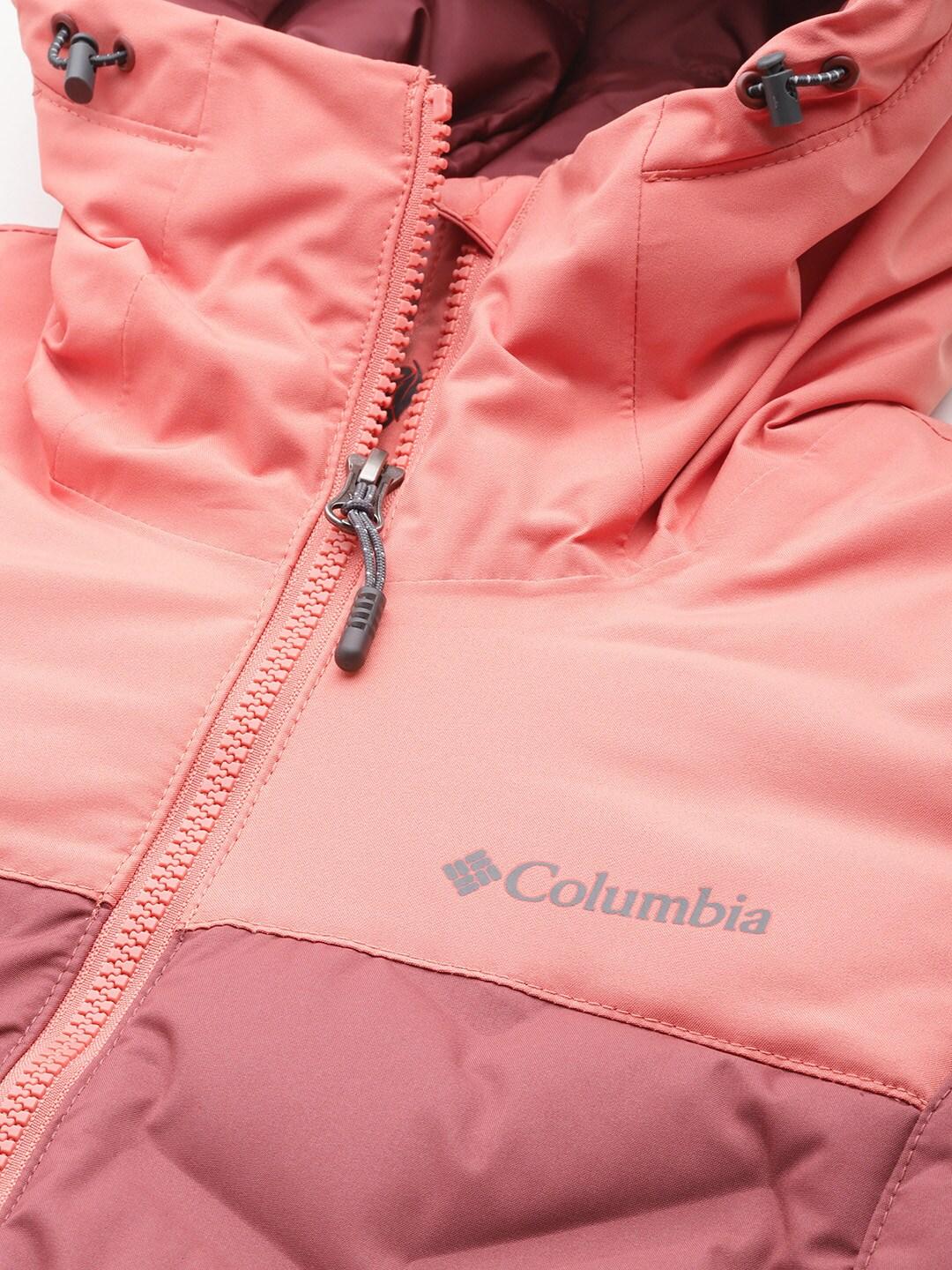 A Women Wearing Columbia Women Pink Grand Trek II Down Jacket