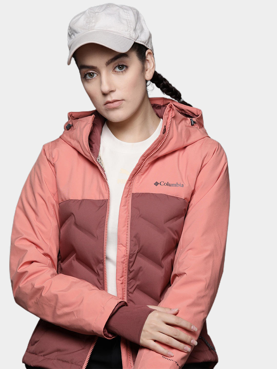 A Women Wearing Columbia Women Pink Grand Trek II Down Jacket