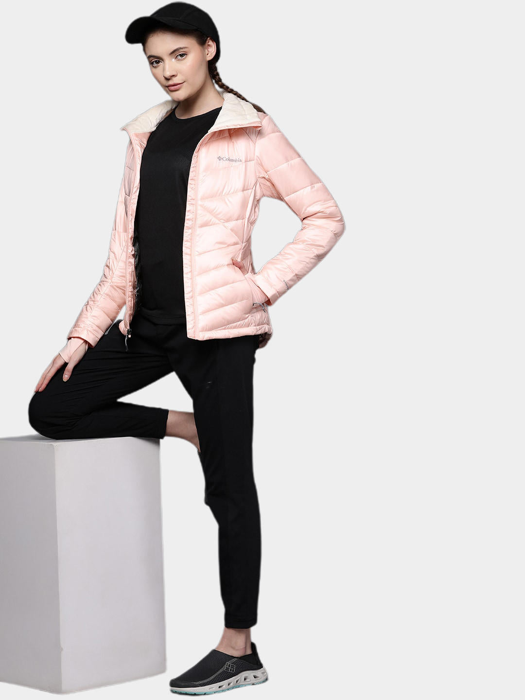 A Women Wearing Columbia Women Peach Joy Peak Jacket